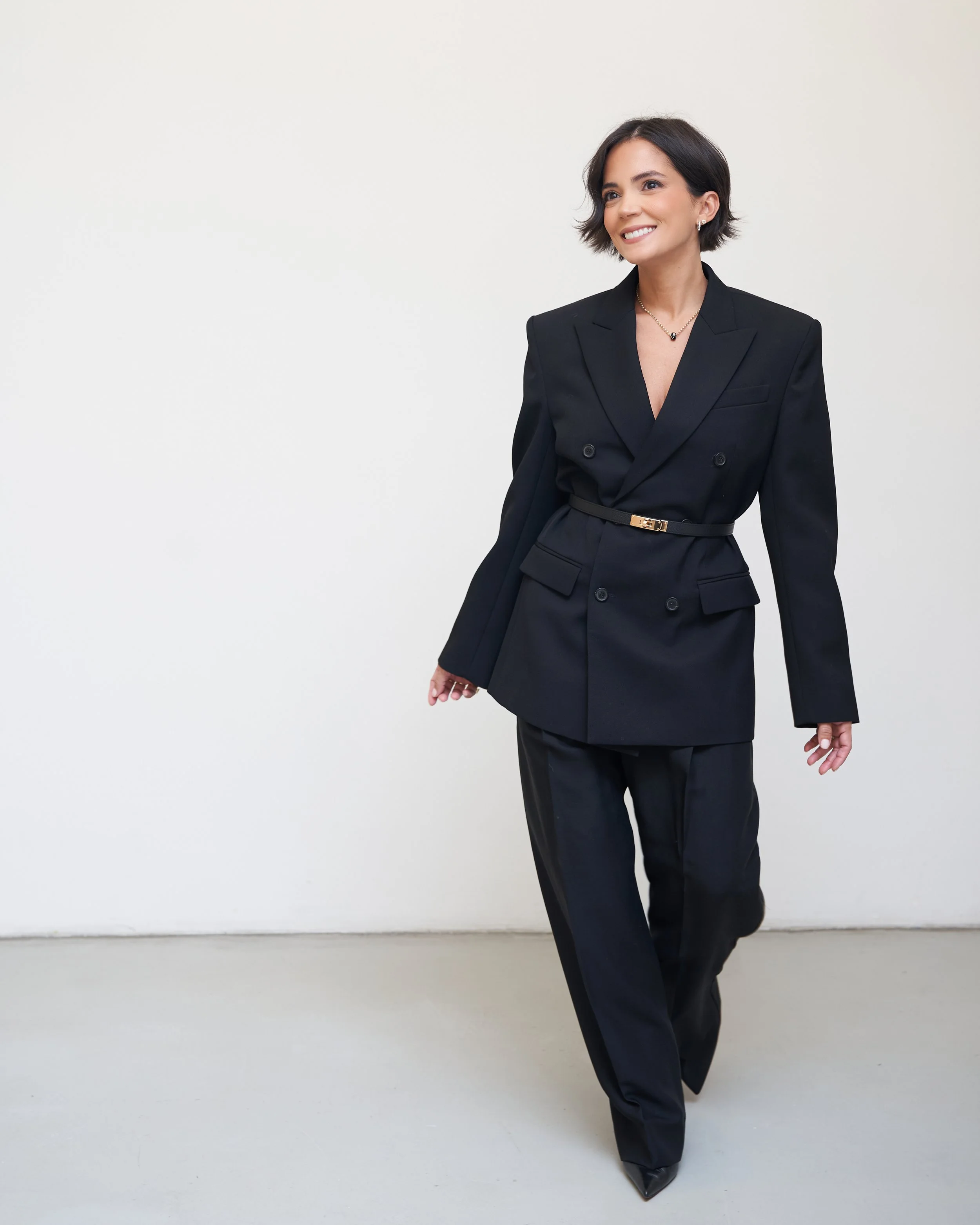 Melissa of Styled by Meeshamore in a tailored black suit, special occasion styling