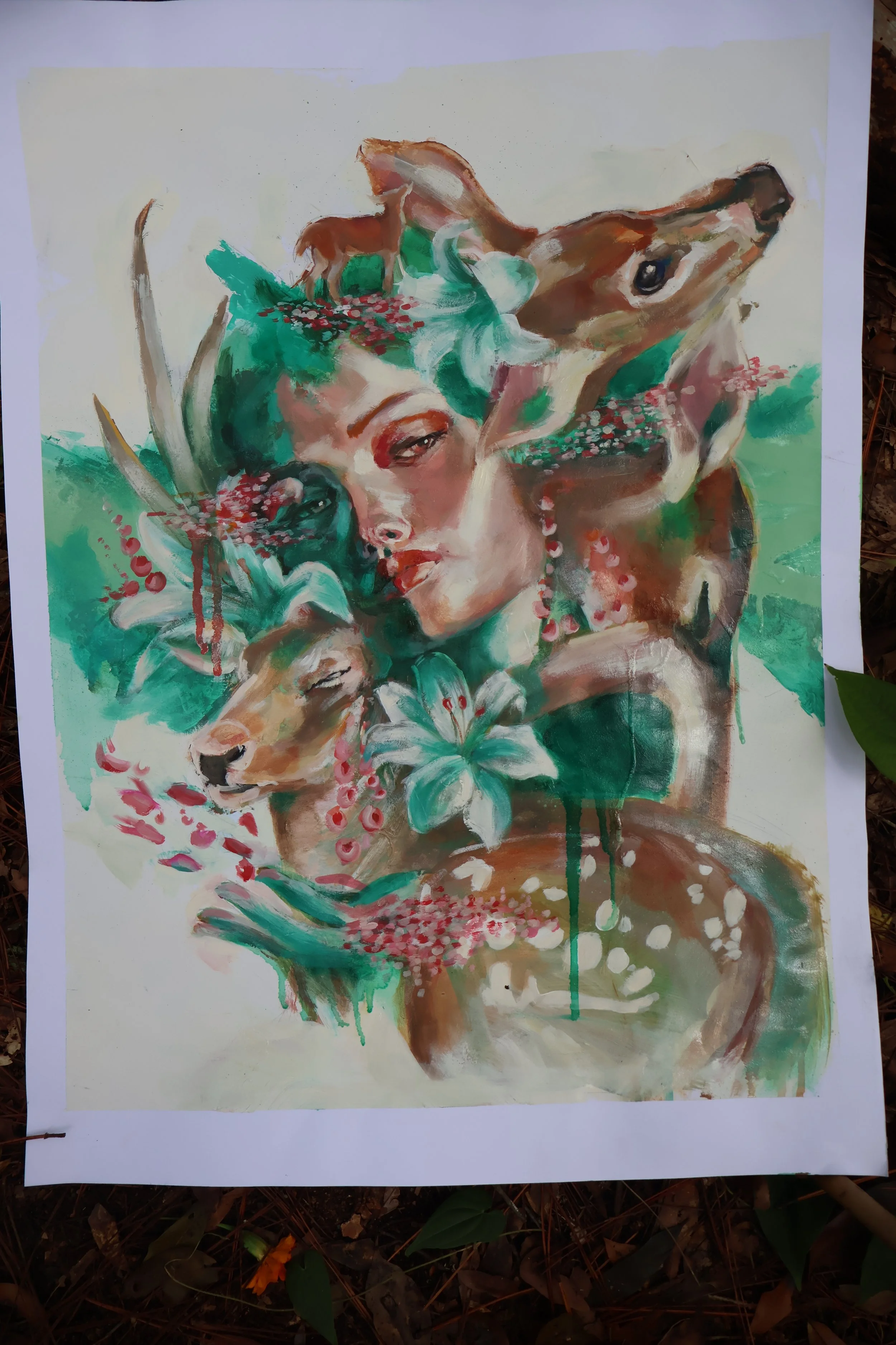 Colorful abstract painting of overlapping faces surrounded by green foliage and pink flowers