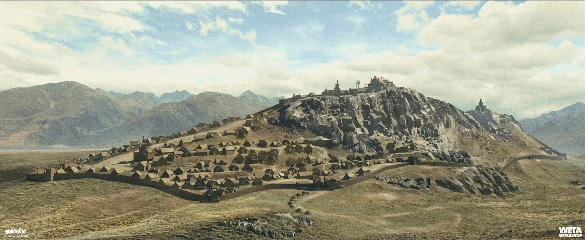 Digital rendering of a mountainous medieval castle and village with stone walls, towers, and numerous small houses on a hillside, under a partly cloudy sky.