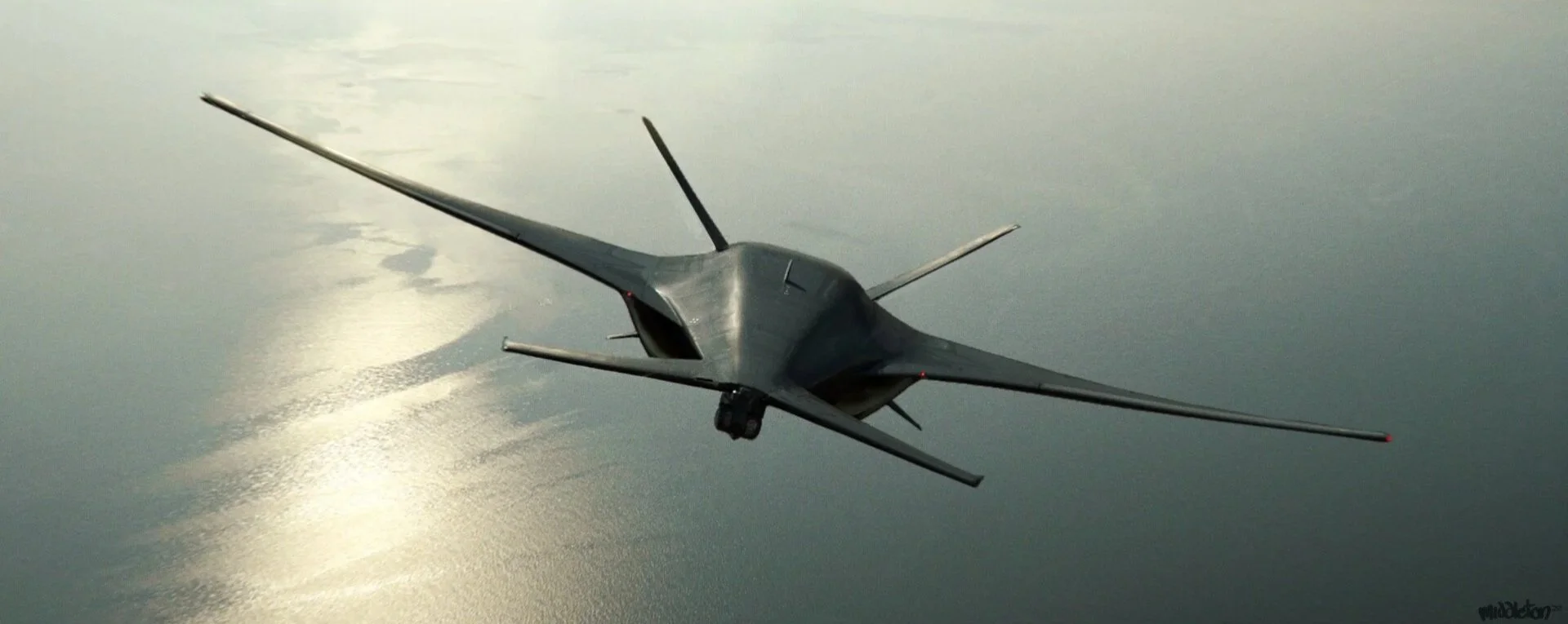 A military jet flying over a body of water during daylight.