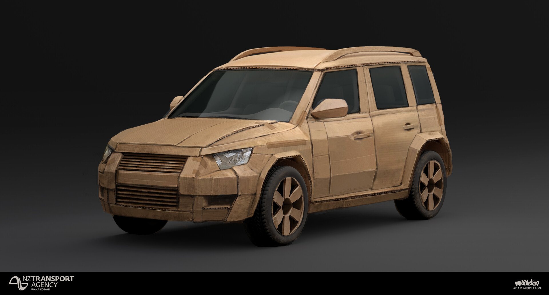 A miniature car made entirely of cardboard with detailed features, set against a dark background.