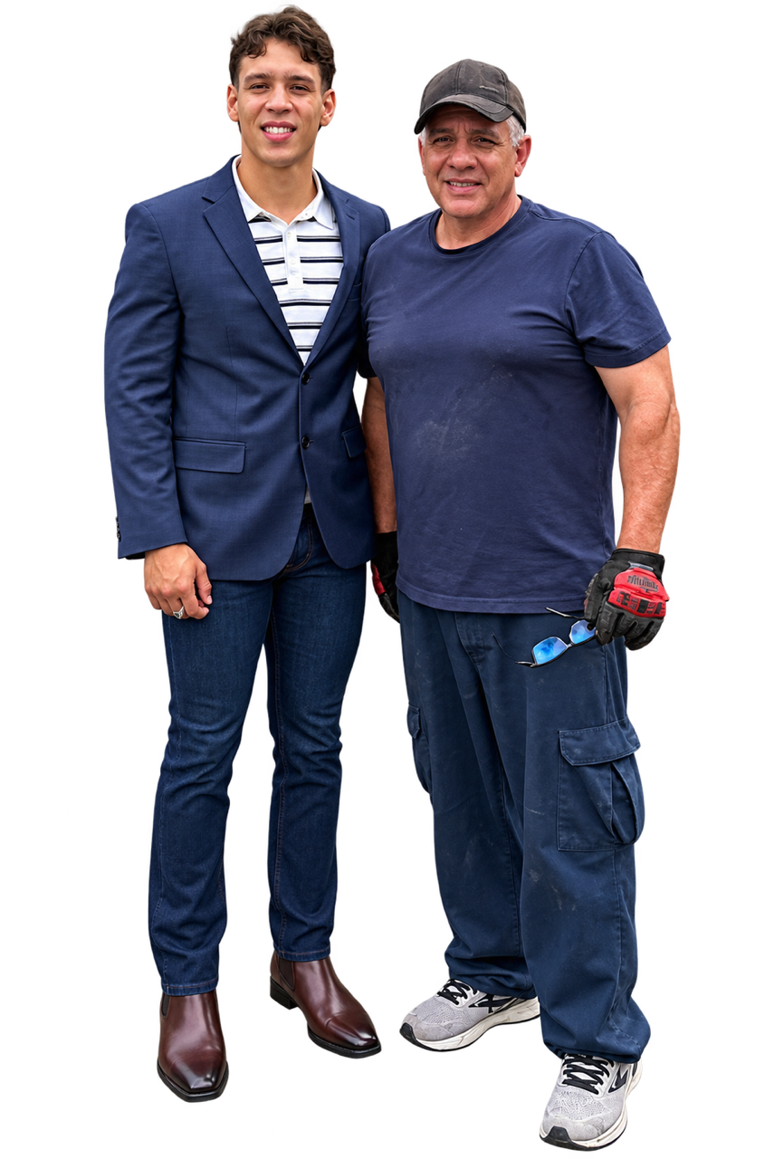 A young man in a blue suit standing next to a construction worker in casual clothing, holding sunglasses, and both posing for the camera.