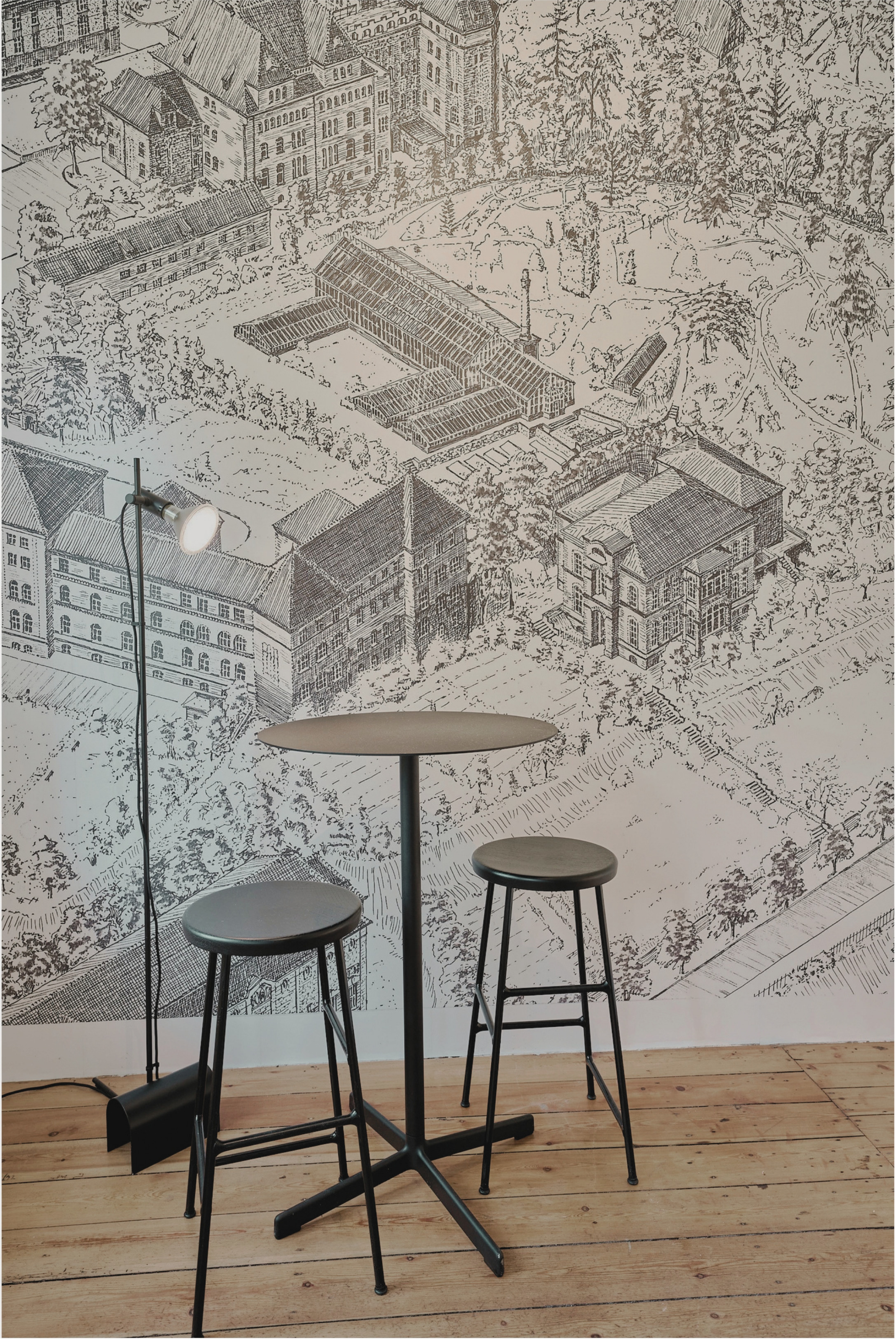 Sitzbereich im Topfhaus Kiel mit großformatiger Wandtapete nach einem historischen Stich des Botanischen Gartens.