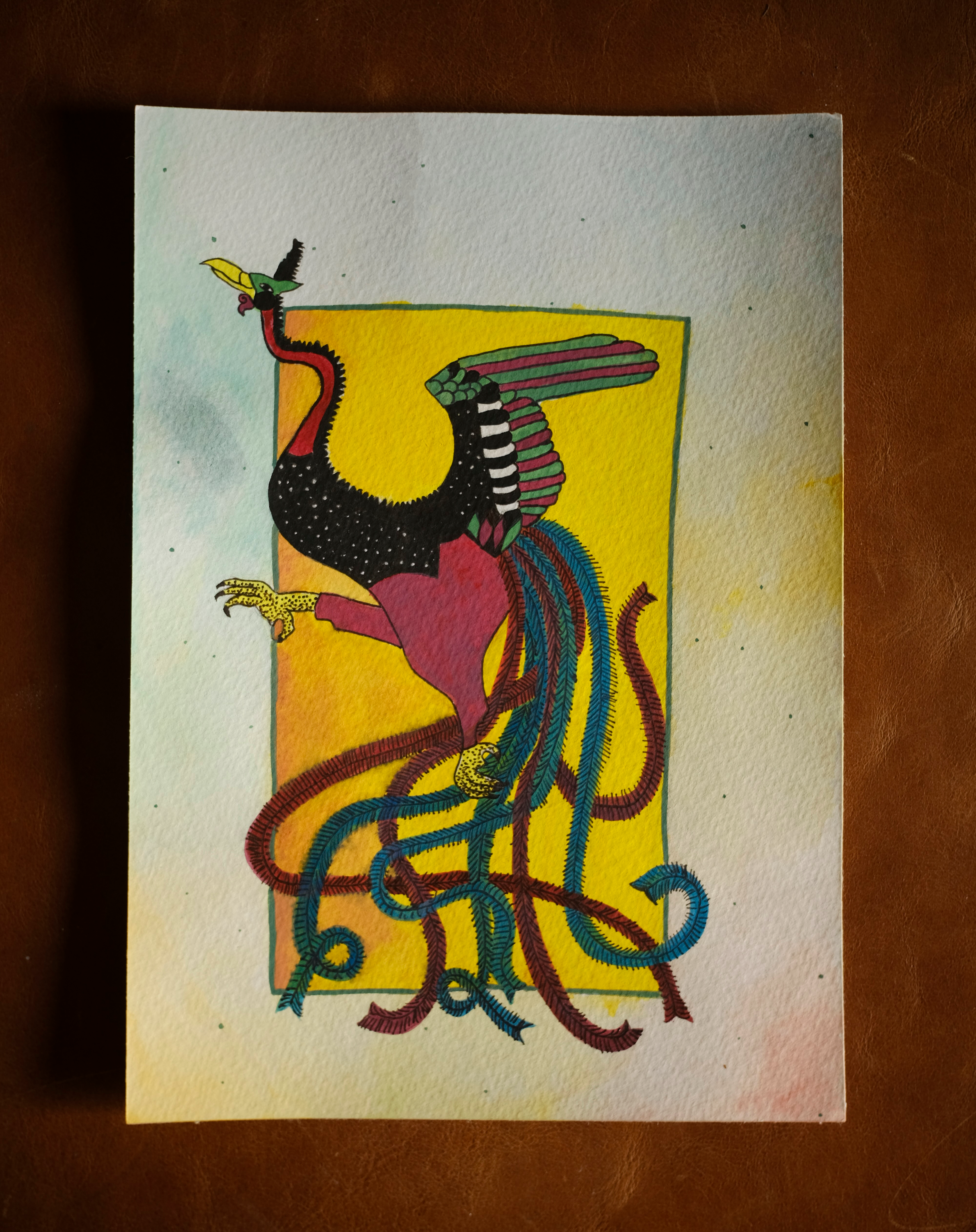 A colorful illustration of a phoenix, with vibrant green, red, black, and yellow feathers, set against a yellow background.