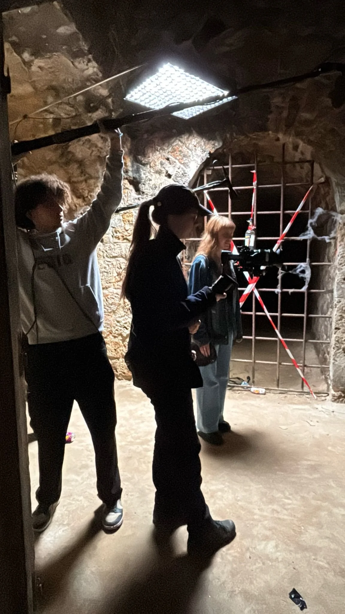 person filming something of frame