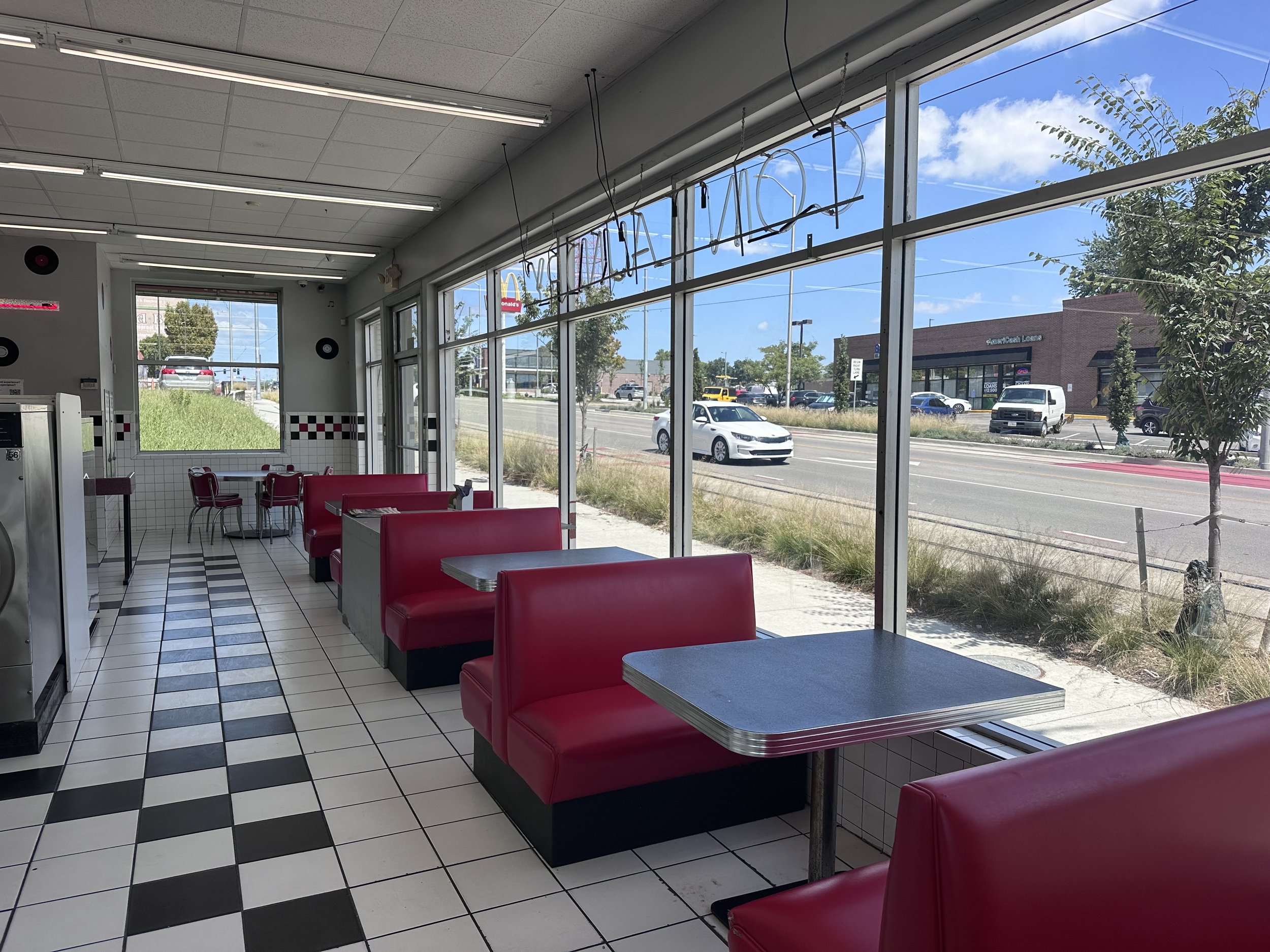 Seating area and front windows inside Main Street Laundry in Midtown Kansas City.