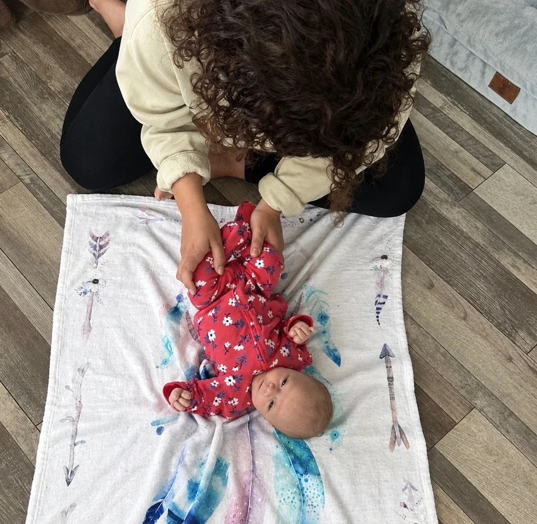Channel Chiropractic chiropractor gently adjusting an infant during a pediatric chiropractic care session in Midland and Odessa, TX.
