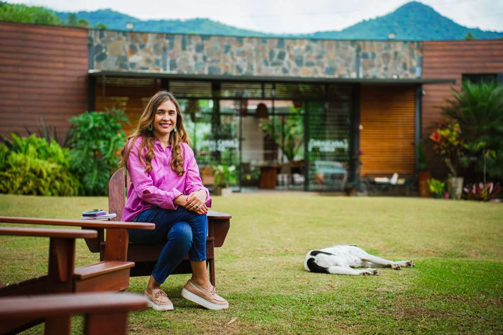 Vivian, owner of Colombia Exploring, seated outdoors.