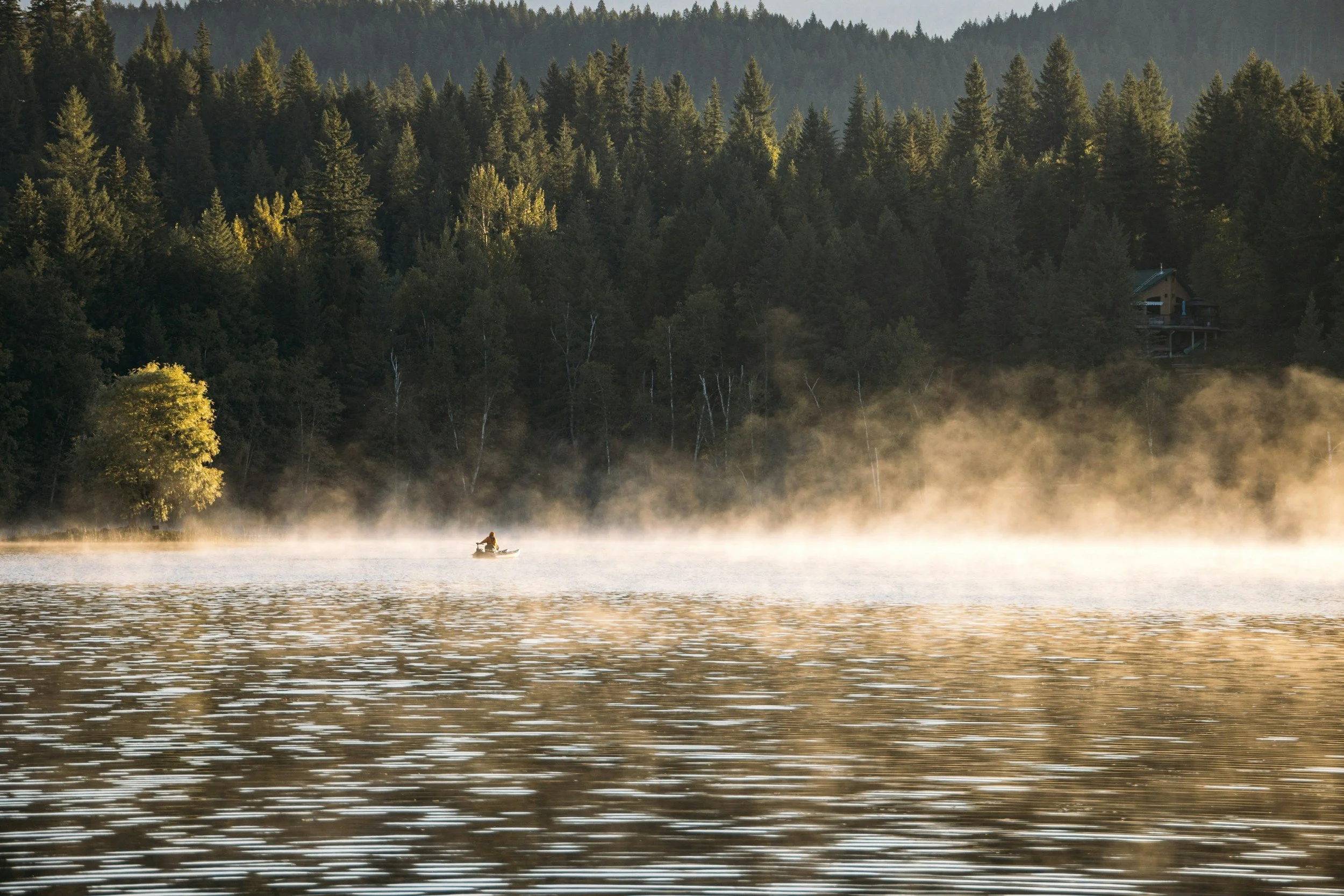 Mist rising off the lake at dawn