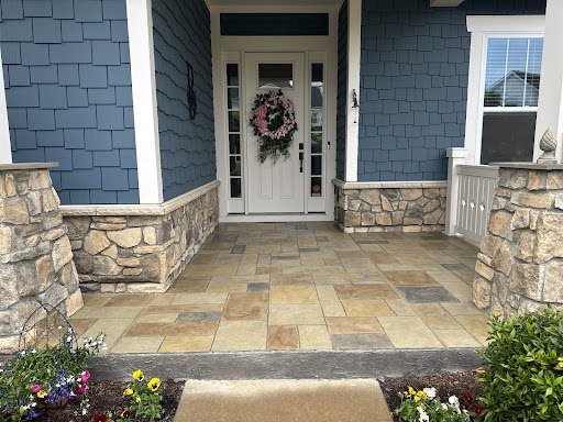 Front porch with a stamped concrete pathway