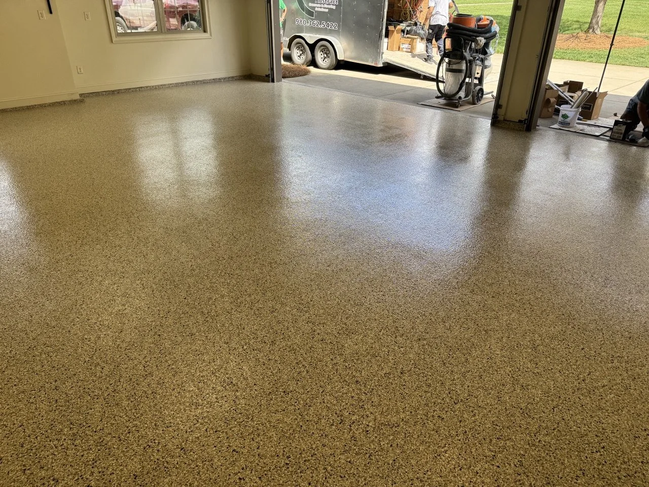 Empty garage with a newly finished flake epoxy floor