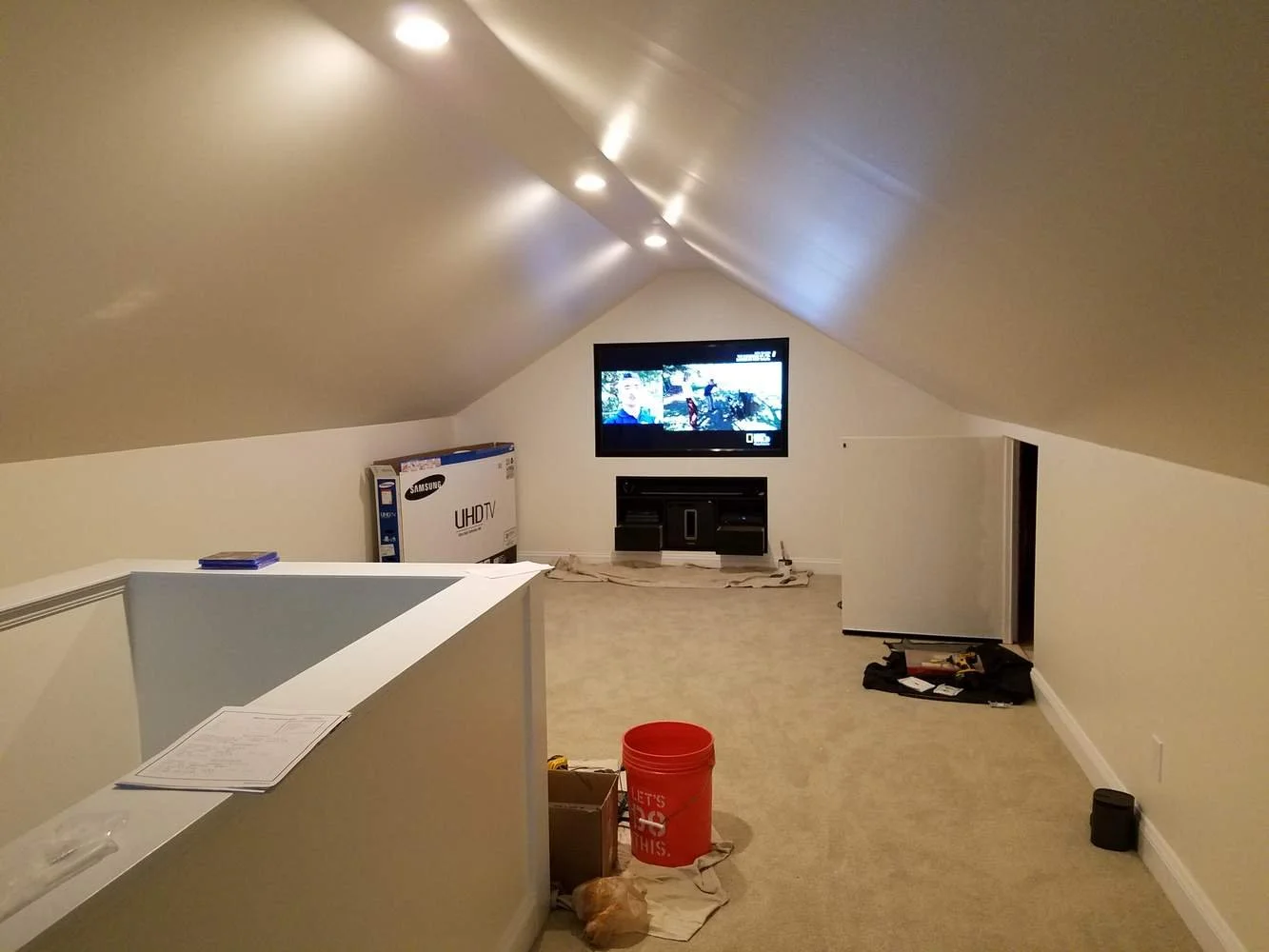 Attic renovation:
Renovating an unfinished attic into an entertainment room