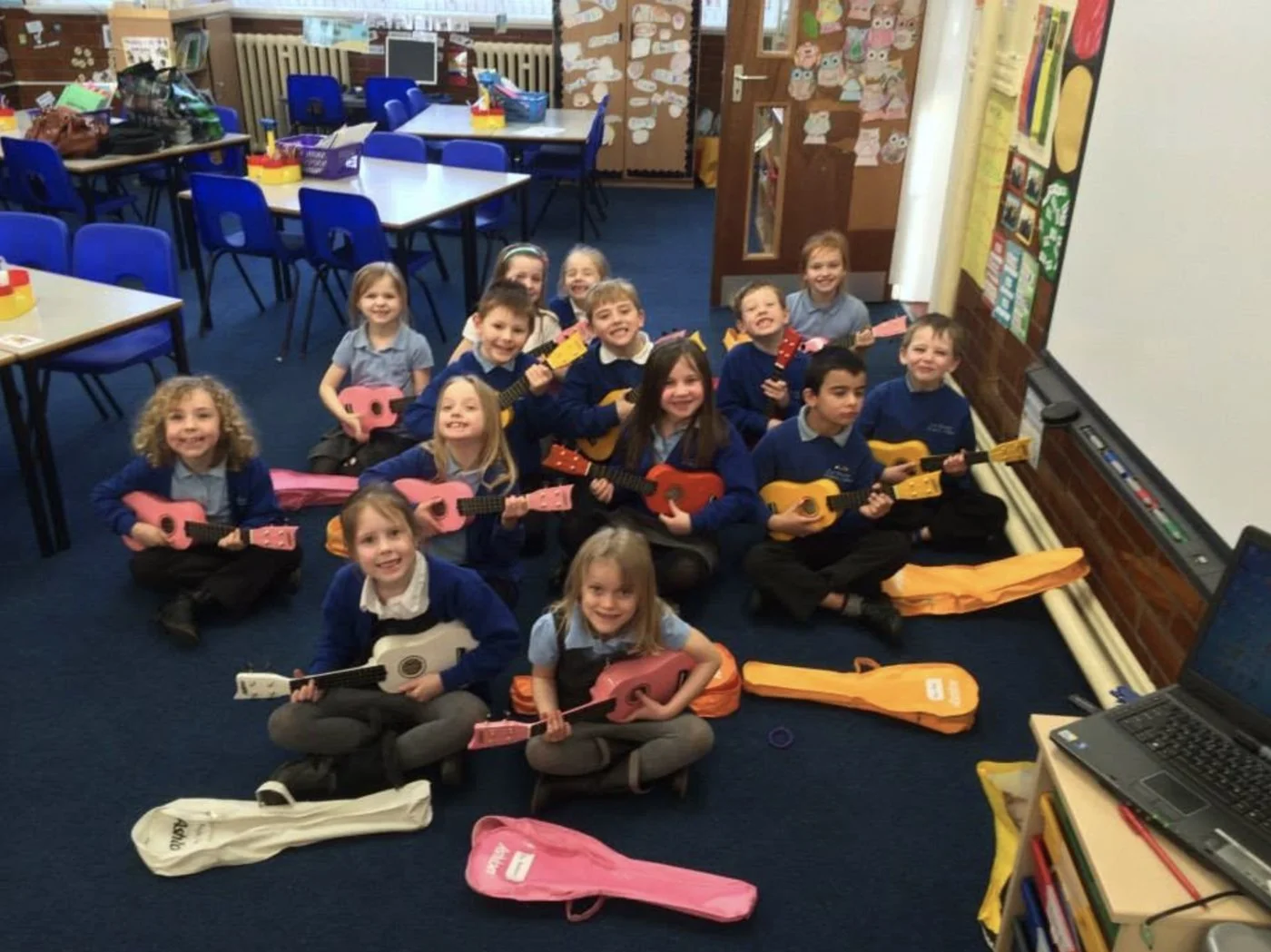 A whole class learning the ukulele together