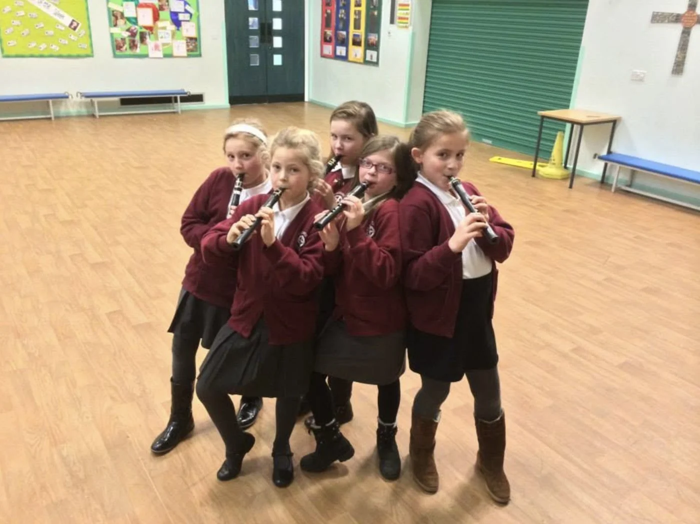 Five pupils playing chalumeau clarinets