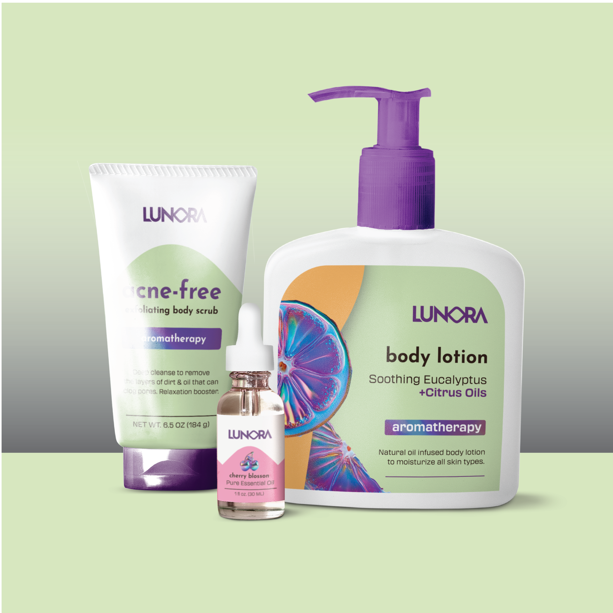 Collection of skincare and aromatherapy products, including a body lotion bottle with purple pump, a tube labeled 'acne-free exfoliating body scrub,' and a small bottle of cherry blossom pure essential oil, with a colorful abstract background.
