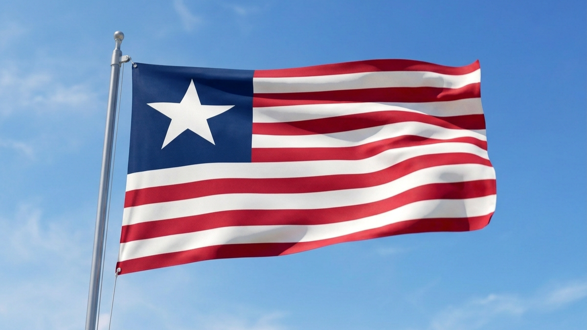 American flag waving in the wind against a blue sky.