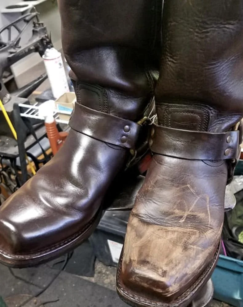 A pair of brown leather boots, one new and shiny, the other worn and scuffed, placed side by side.