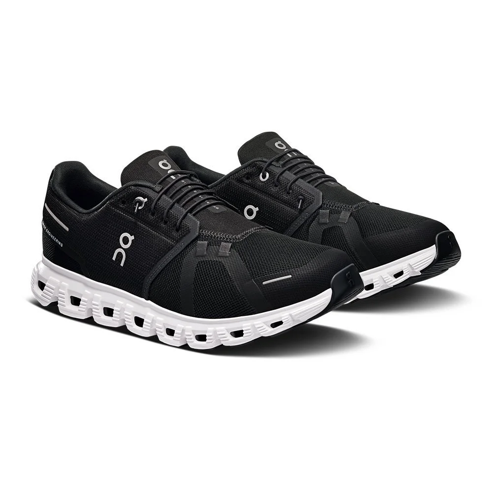Black athletic sneakers with white sole design.