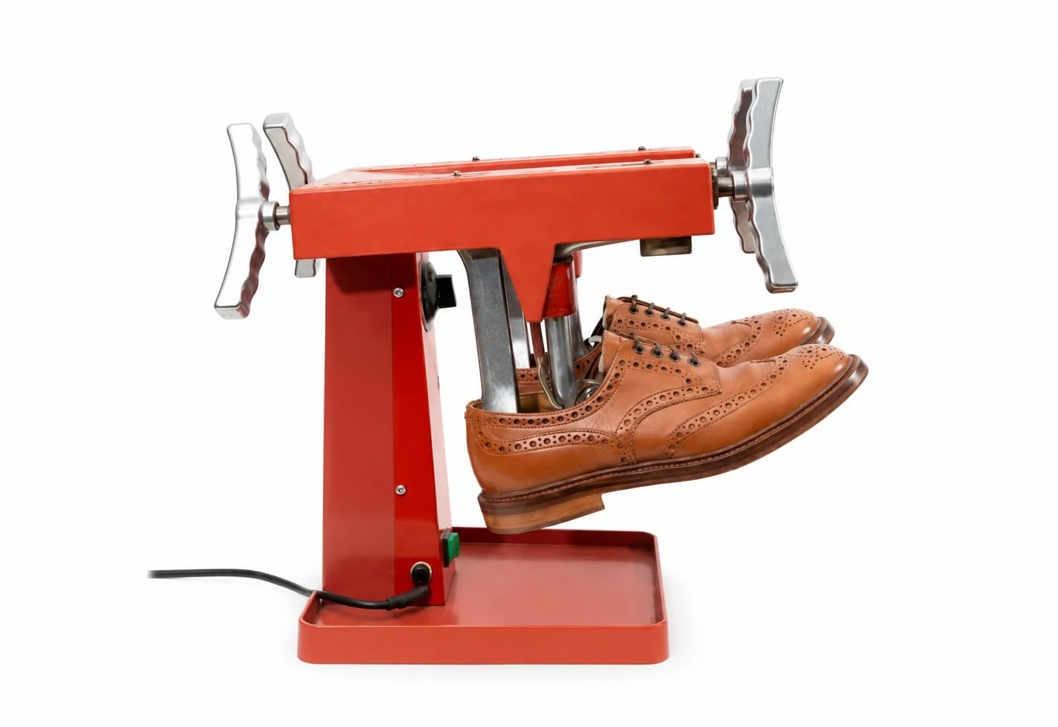 Shoe stretching machine and leather shoes on a clean white background