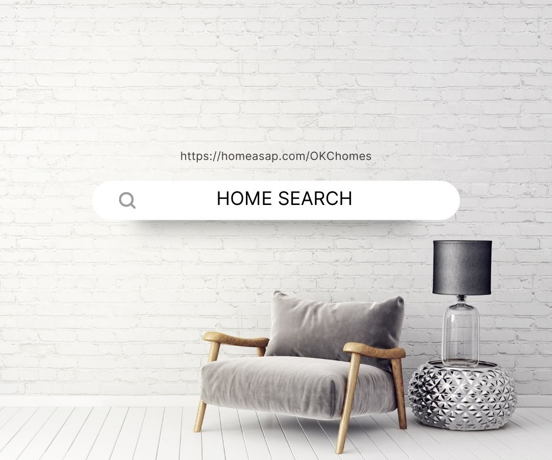 Modern living room featuring a white brick wall, a light gray velvet armchair, a glass table with a black lampshade, and a textured silver side table. HOME SEARCH SIGN FOR OKLAHOMA