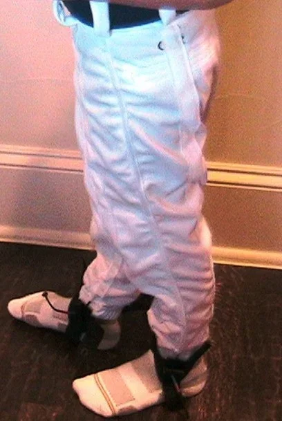 Early-stage Rion's Belt prototype: pants with resistance cords along the seams and ankle straps