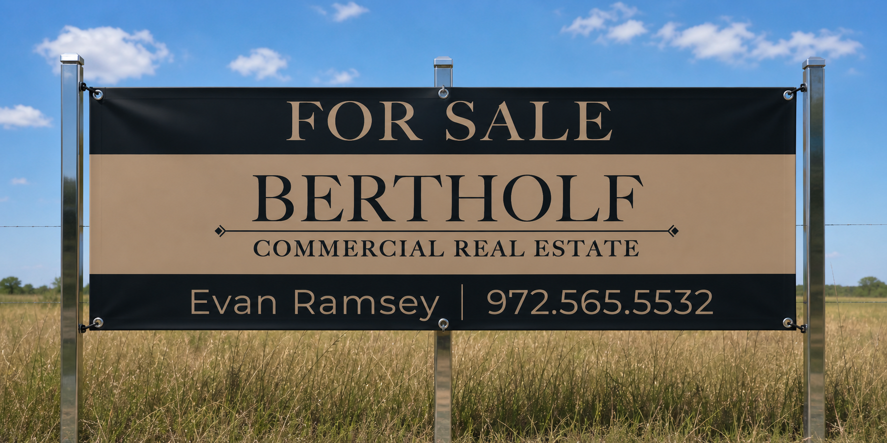 A sign in a grassy field advertising a commercial real estate property for sale by Bertholff. The sign includes contact information for Evan Ramsey, phone number 972.565.5532.