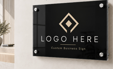 Black custom business sign with geometric logo and placeholder text on a wall