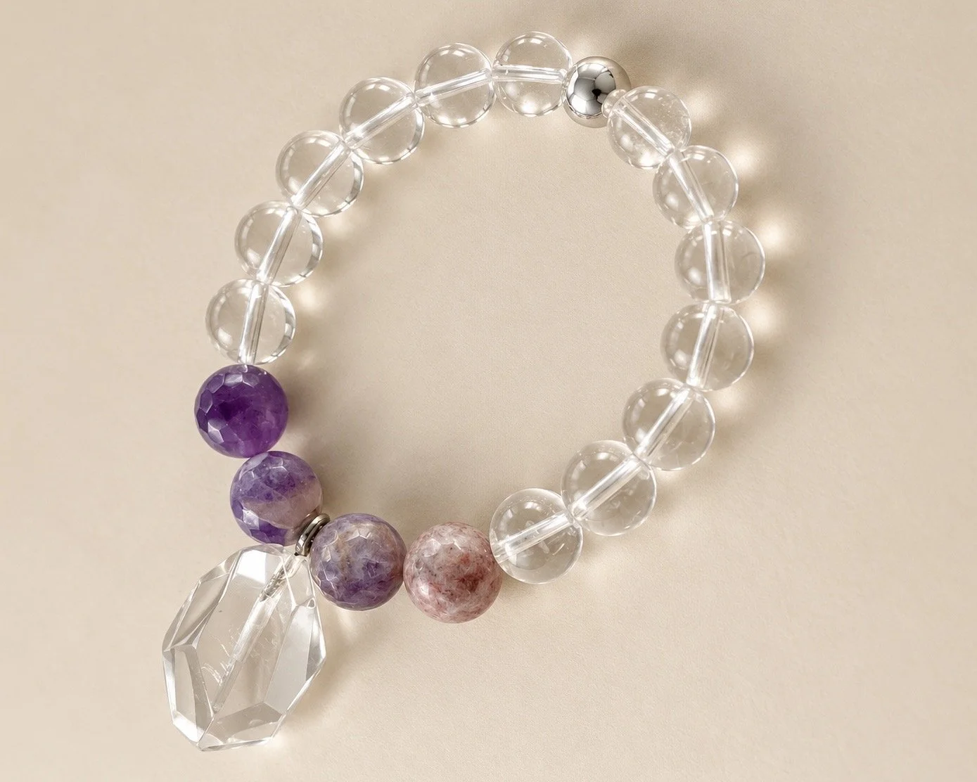 Clear quartz with quartz pendant.jpg