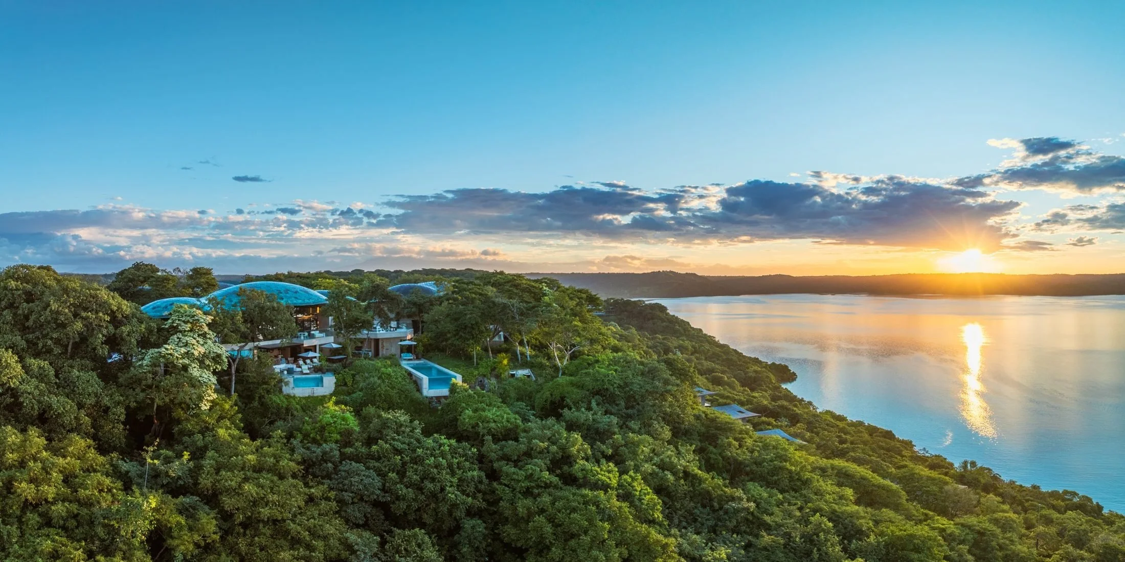Villas with dome roofs above the bay at sunset in Peninsula Papagayo, Costa Rica