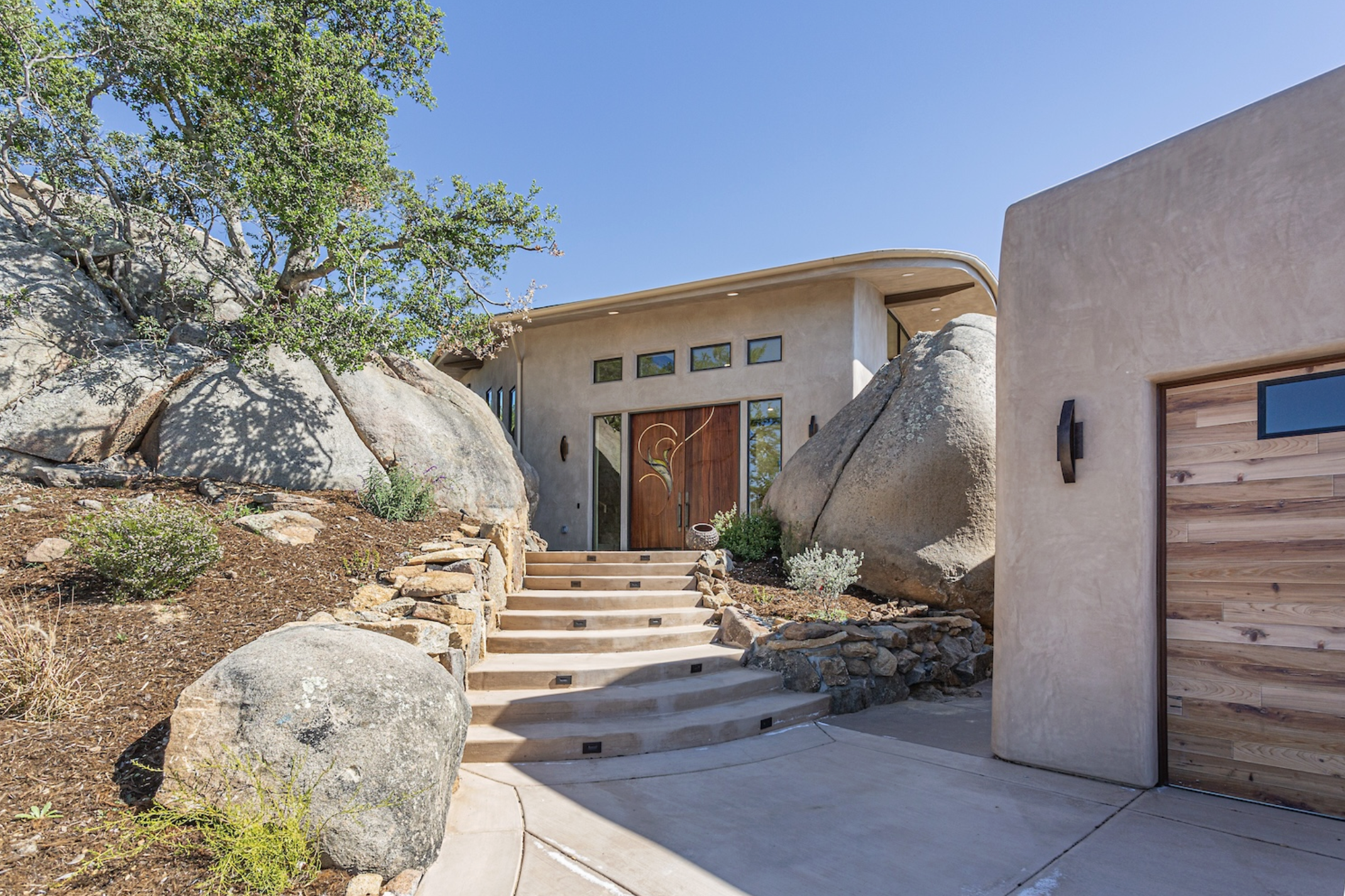 The Serenity Project, a net-zero house by Drew Hubbell of Hubbell & Hubbell, built around granite boulders in northern Escondido.