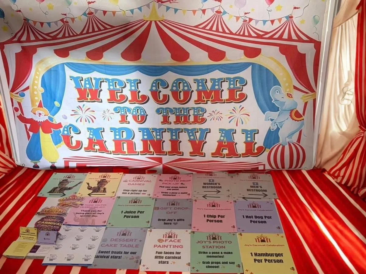 Carnival-themed party display featuring custom signs, printed activities, and coordinated event decorations.