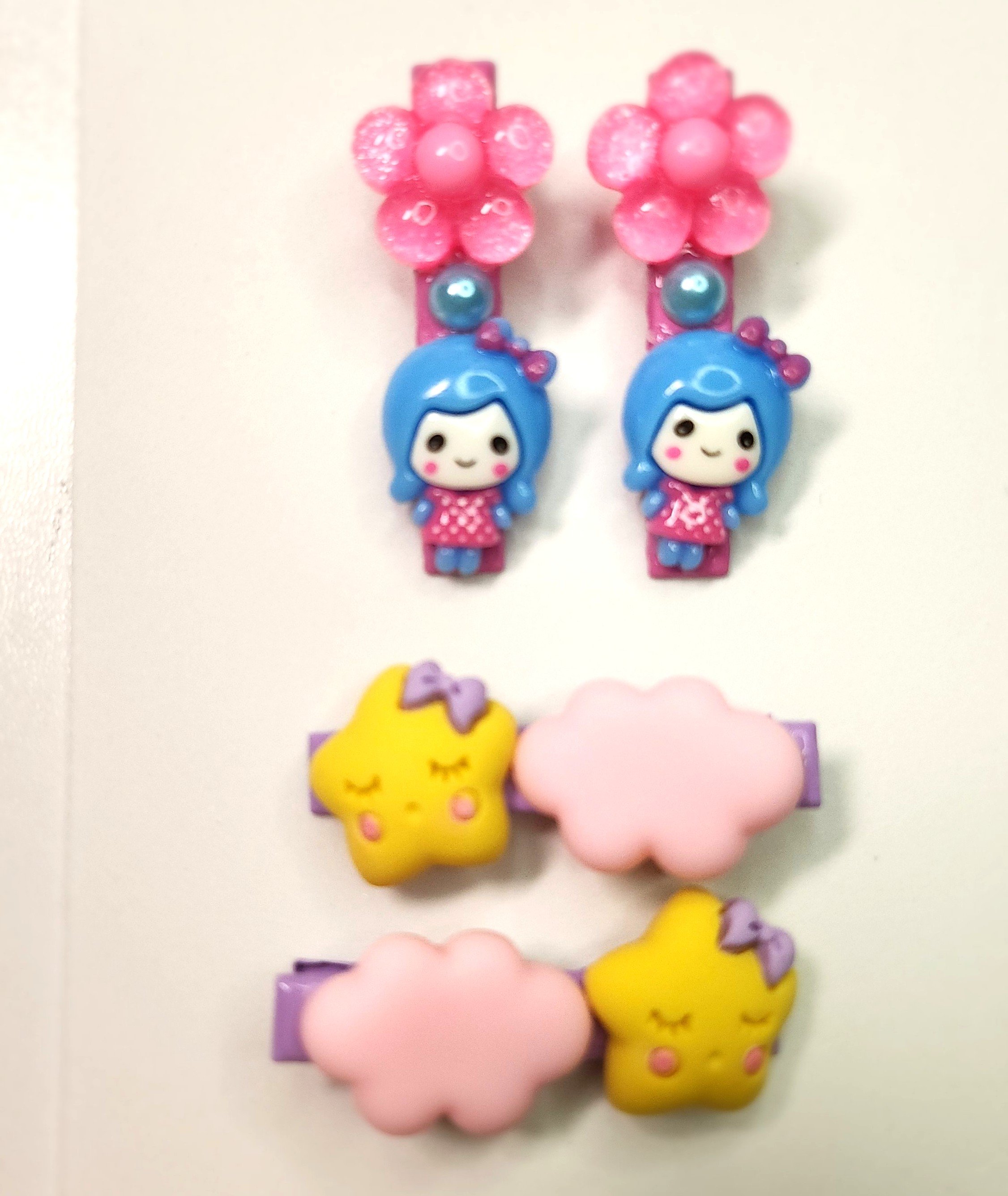 A SET OF TWO BLUE HAIRED GIRLS WITH PINK DRESSES WITH PINK FLOWERS AND SUN AND CLOUD HAIRCLIPS.jpg