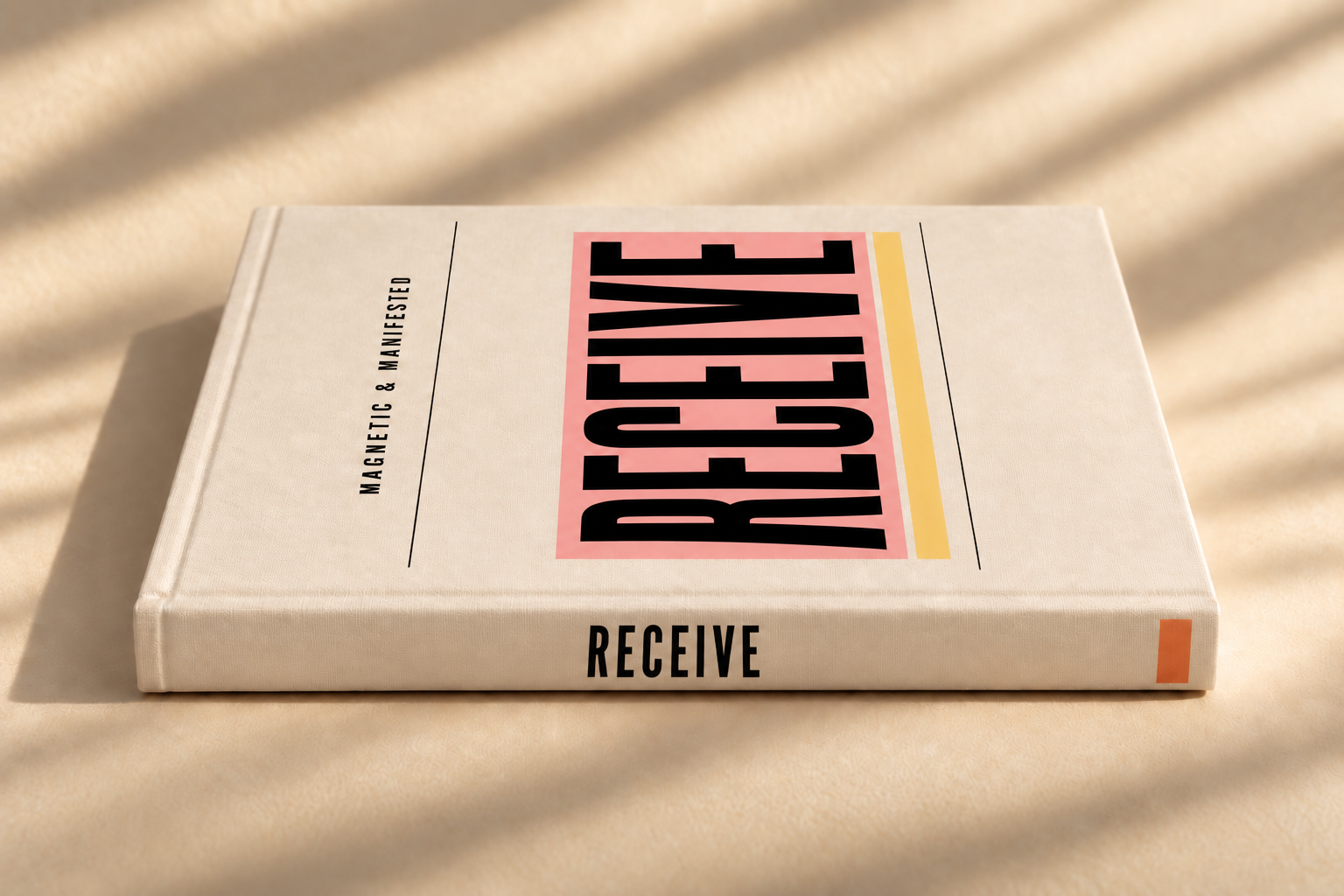 A book titled 'MAGNETIC & MANIFESTED' with the word 'RECEIVE' written on the spine, placed on a light surface with shadows from window blinds.