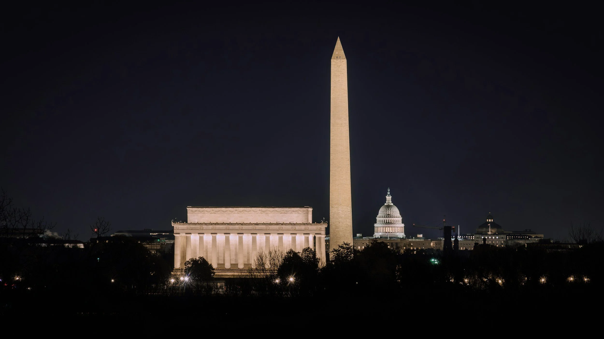 Washington DC skyline at night with the Lincoln Memorial, Washington Monument and Capitol