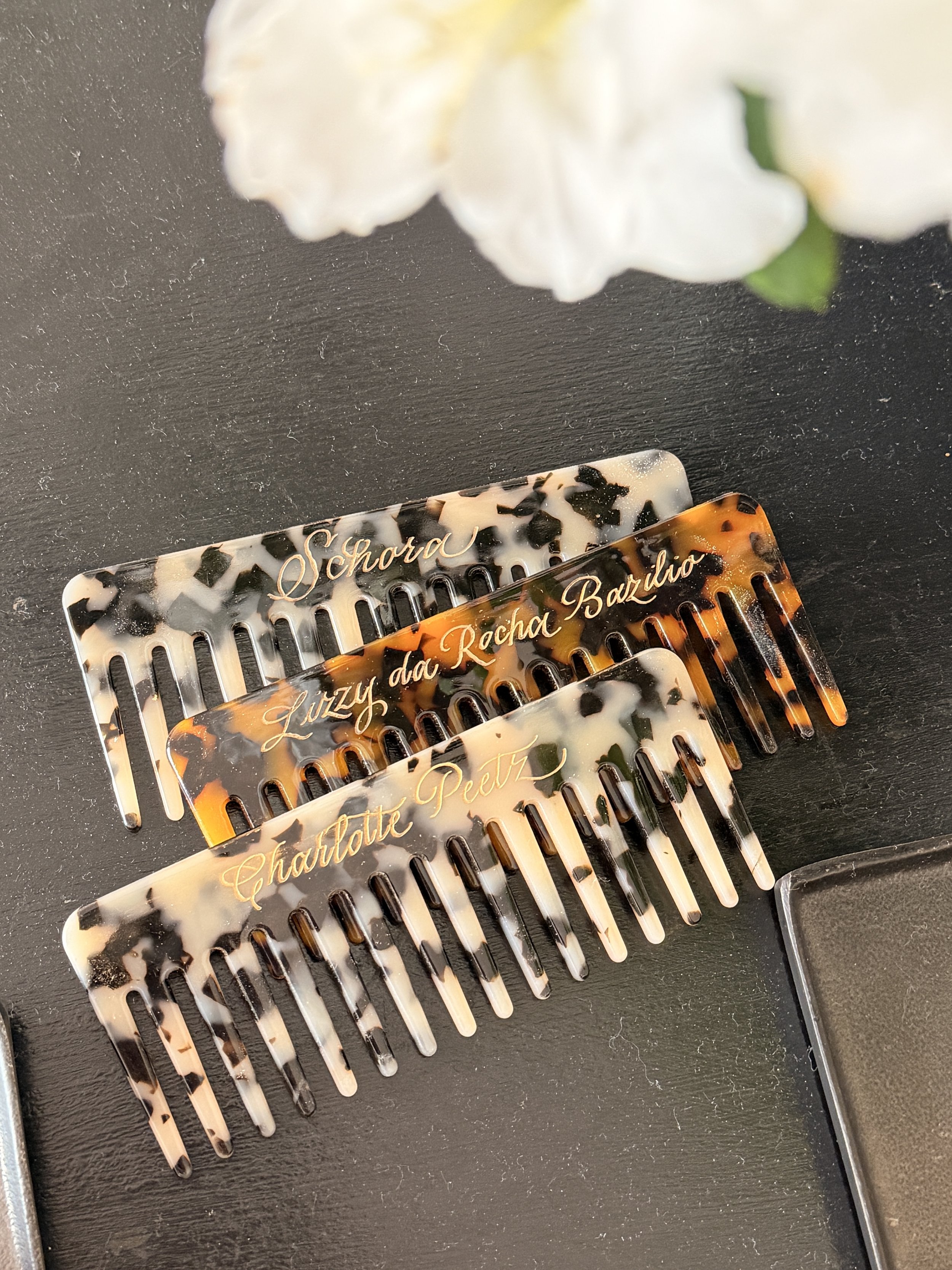 Custom-engraved comb created for a Nakd pop-up store activation