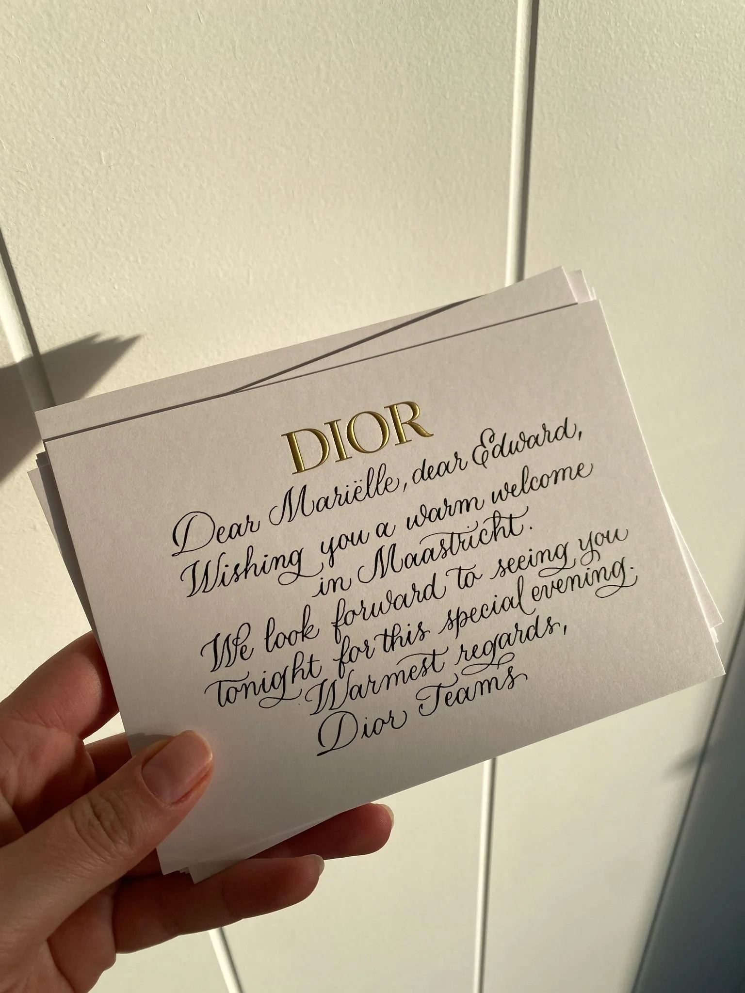 Fine-line calligraphy lettering on textured paper for Dior Nederland