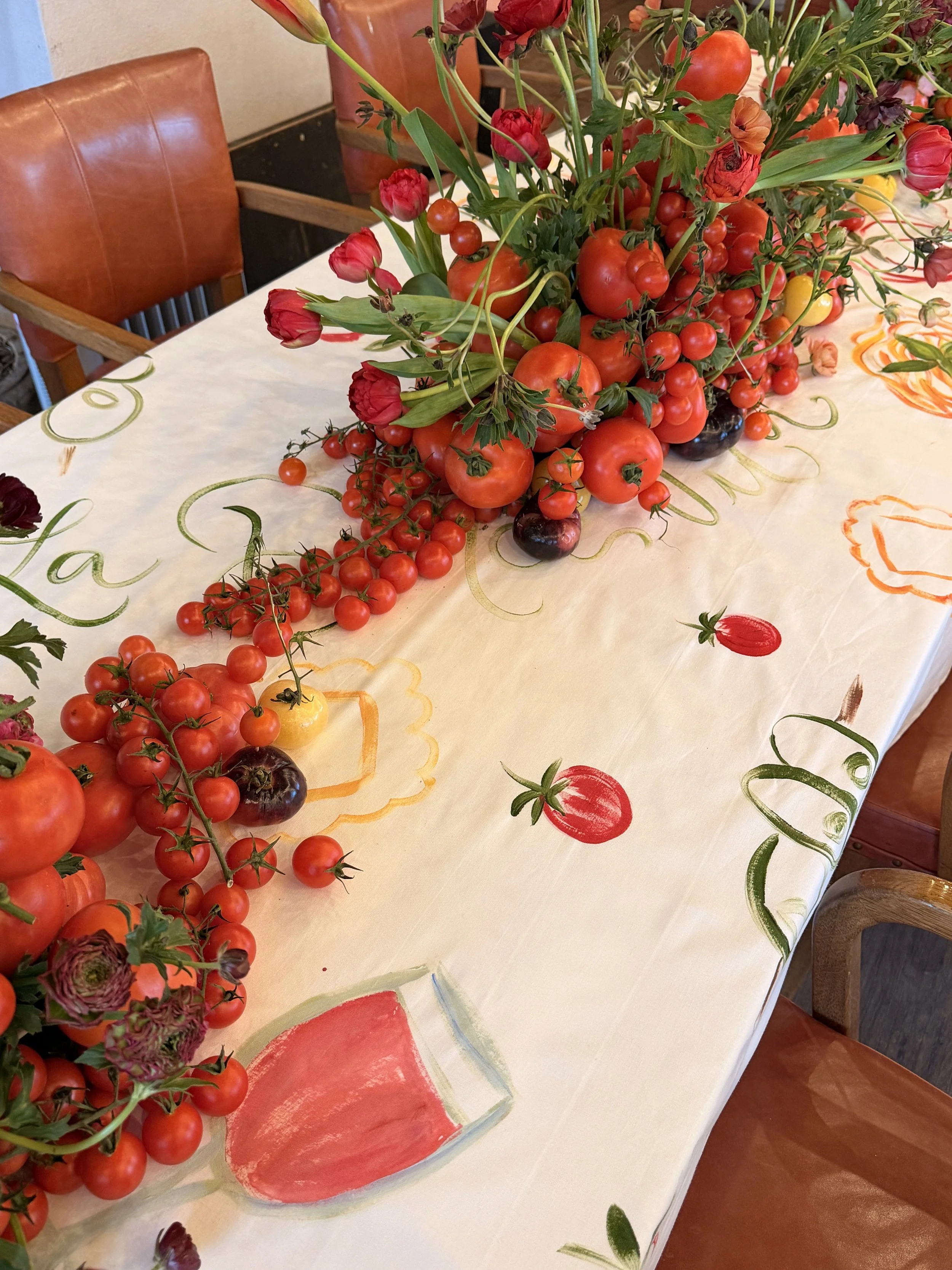 Original painted motifs integrated into an Italian-themed dinner table setting