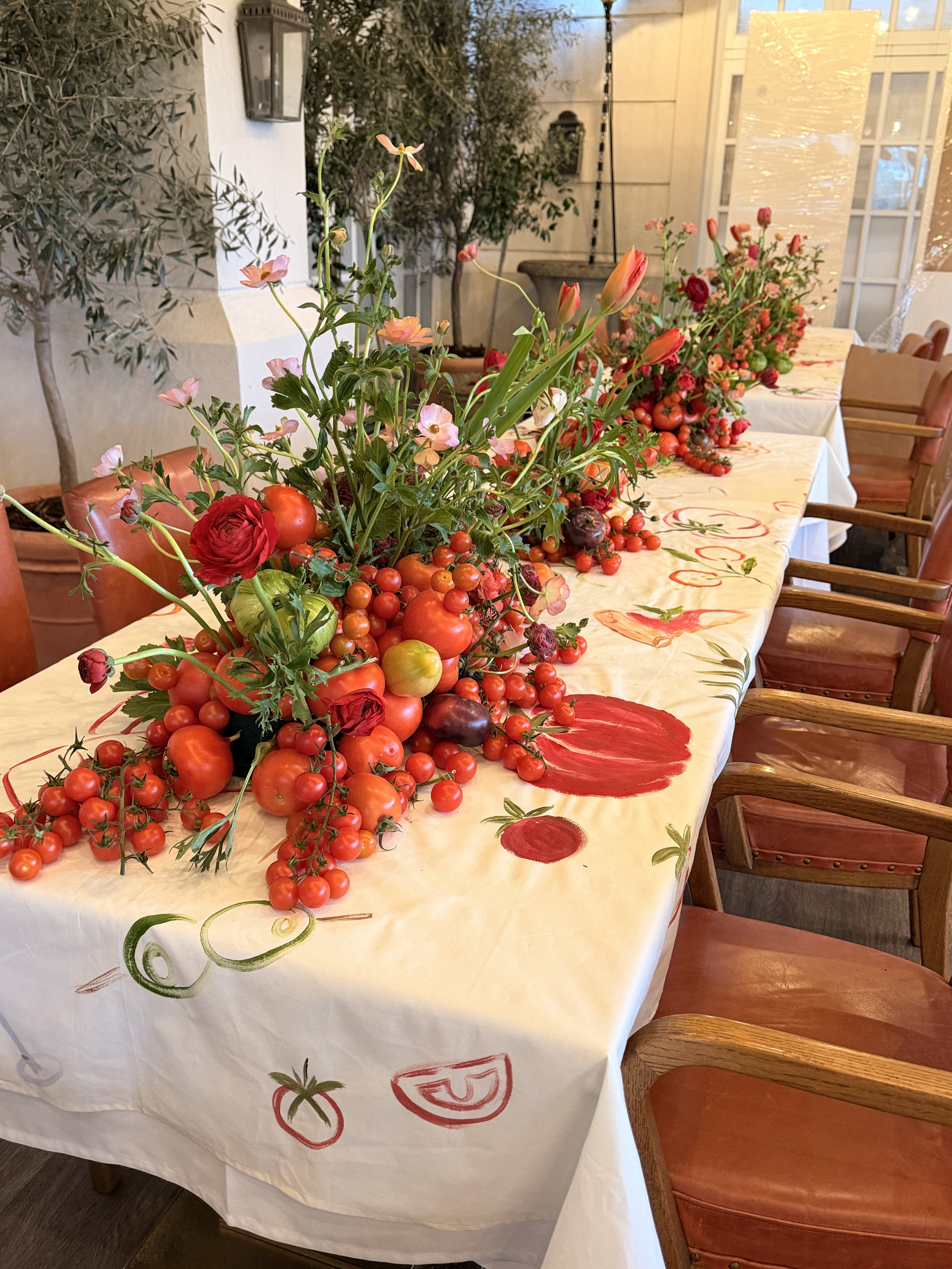 Hand-painted tablecloths styled for a TikTok Italian-themed dinner in the UK