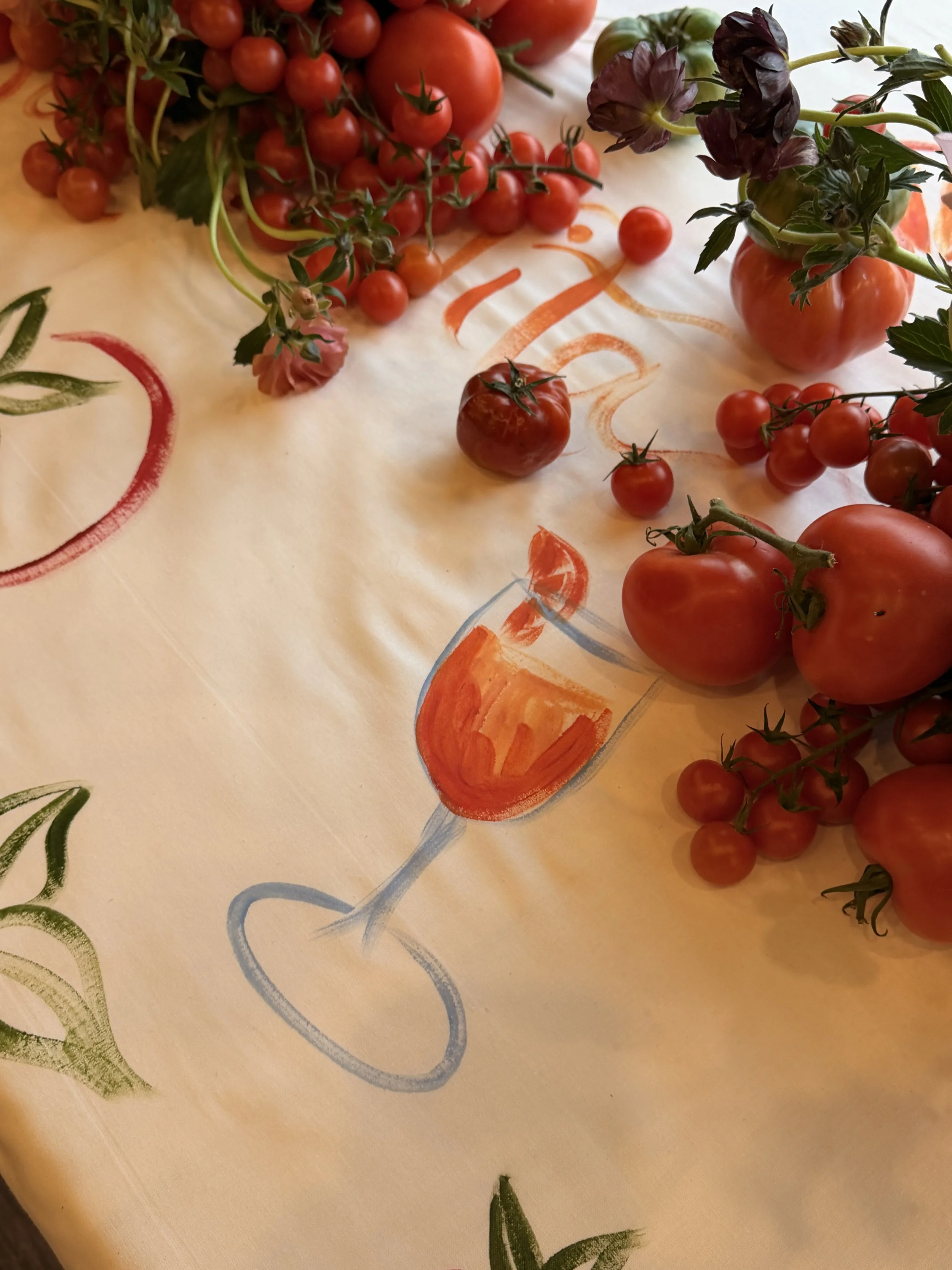 Hand-painted textile details across a styled event dining table