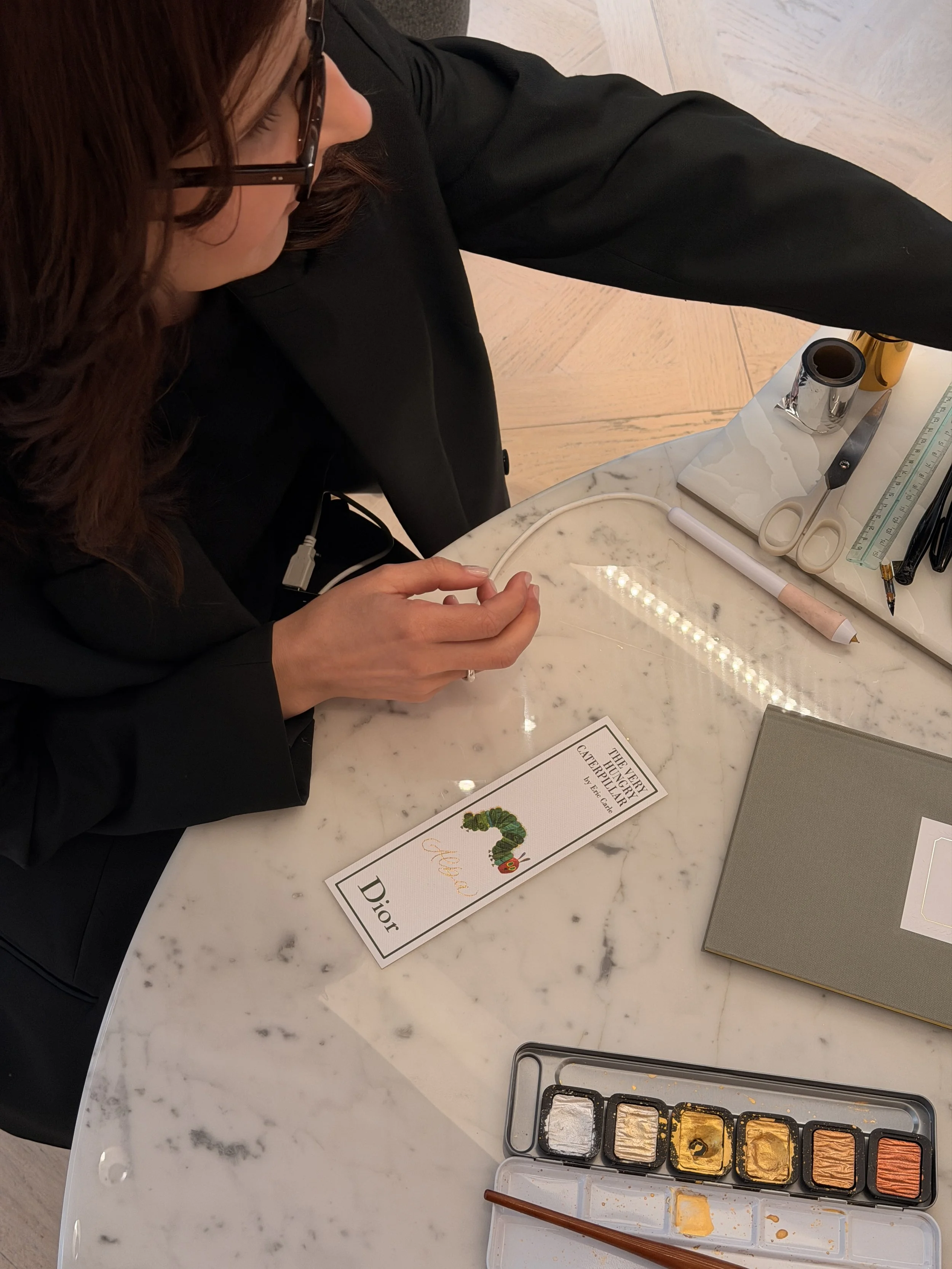Dior Couture: luxury brand personalisation, live calligraphy and engraving for fashion houses.