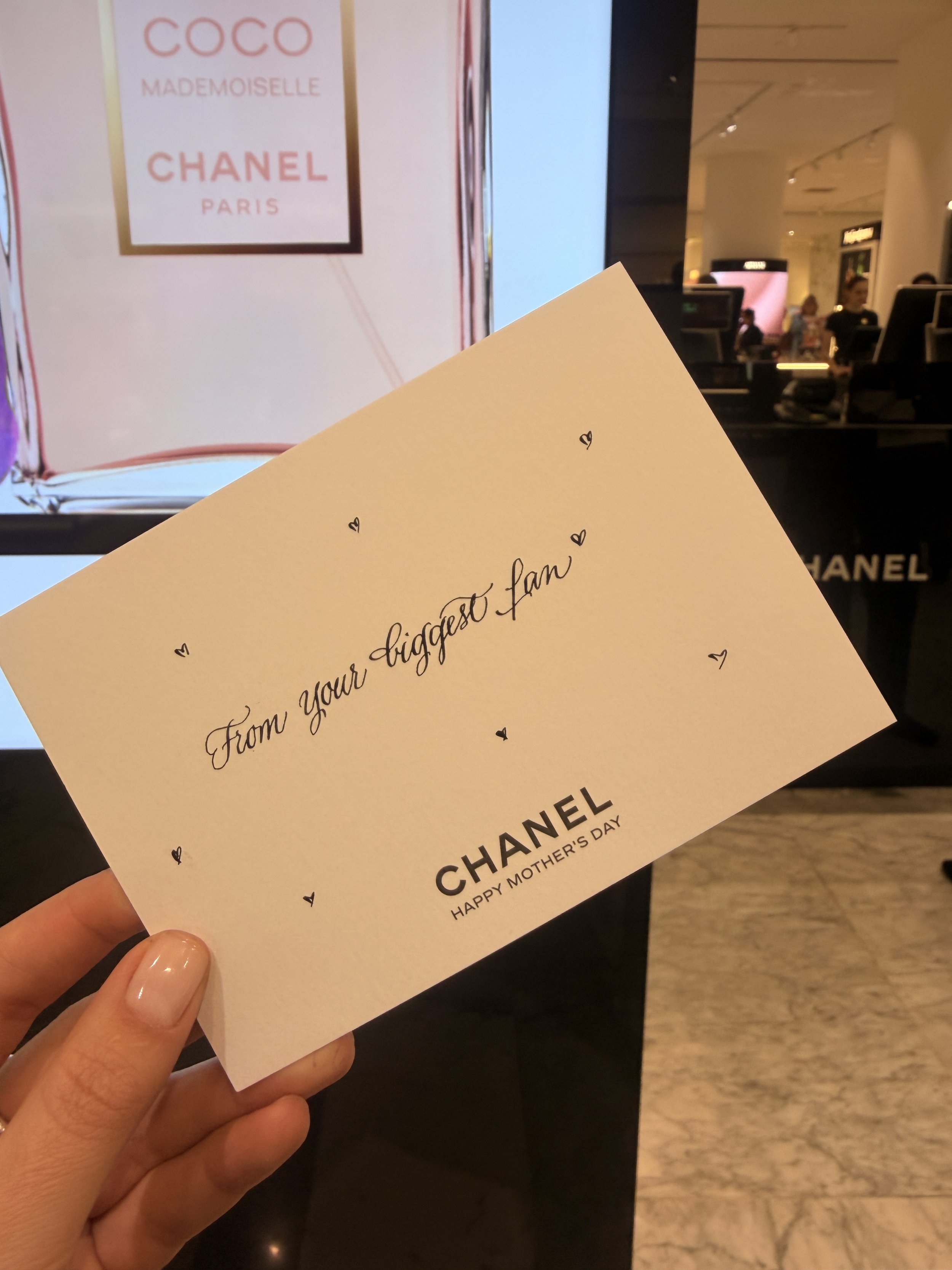 Handwritten calligraphy on a personalised Chanel card at De Bijenkorf Amsterdam