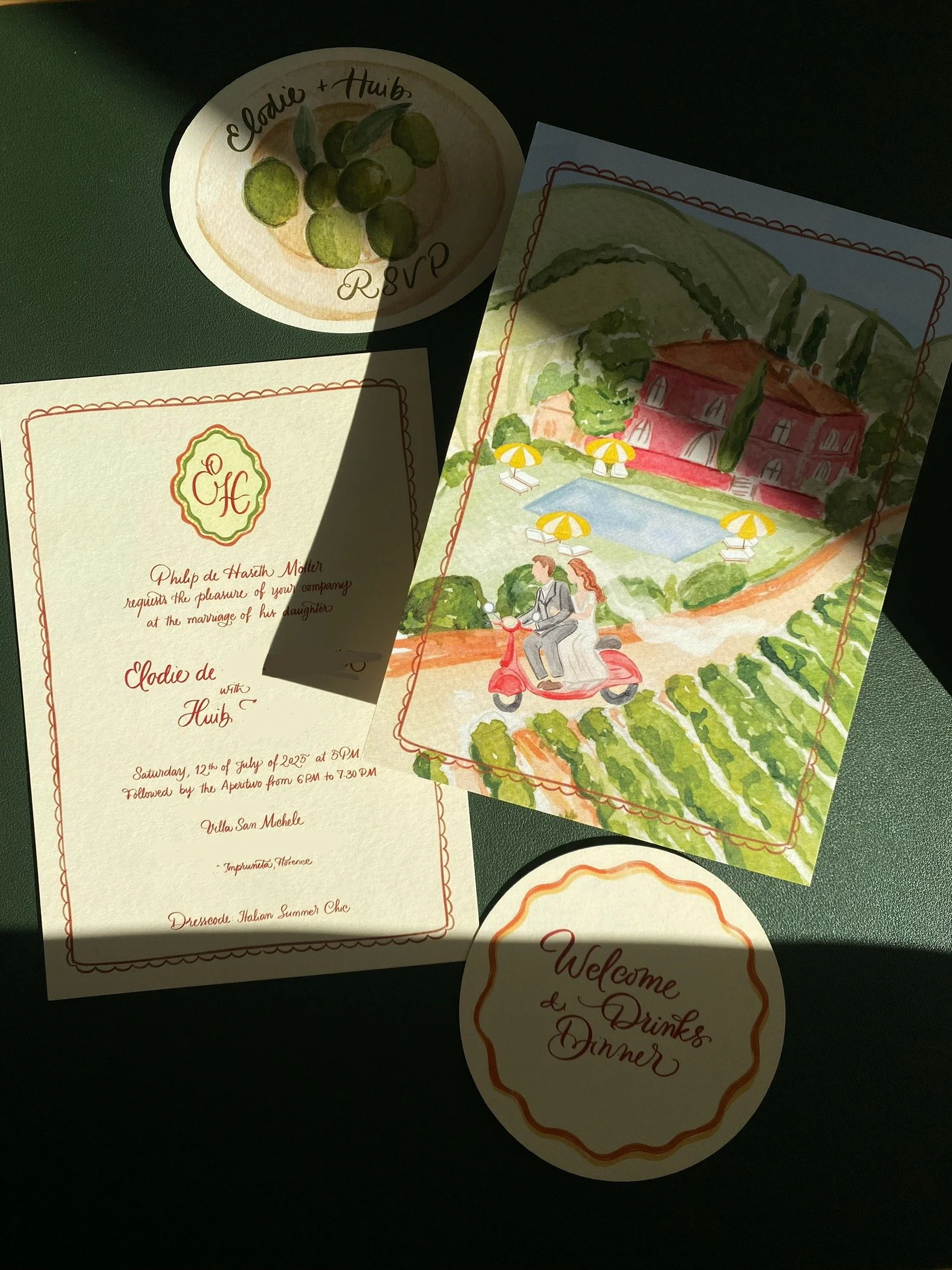 Wedding invitation cards with watercolor illustrations of a villa, pool, and couple riding a scooter, and a RSVP card with green grapes drawing.