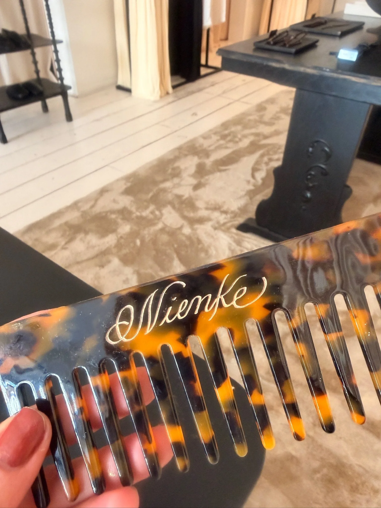 Tortoiseshell-pattern comb for NAKD pop up store personalised with the name Nienke in gold lettering