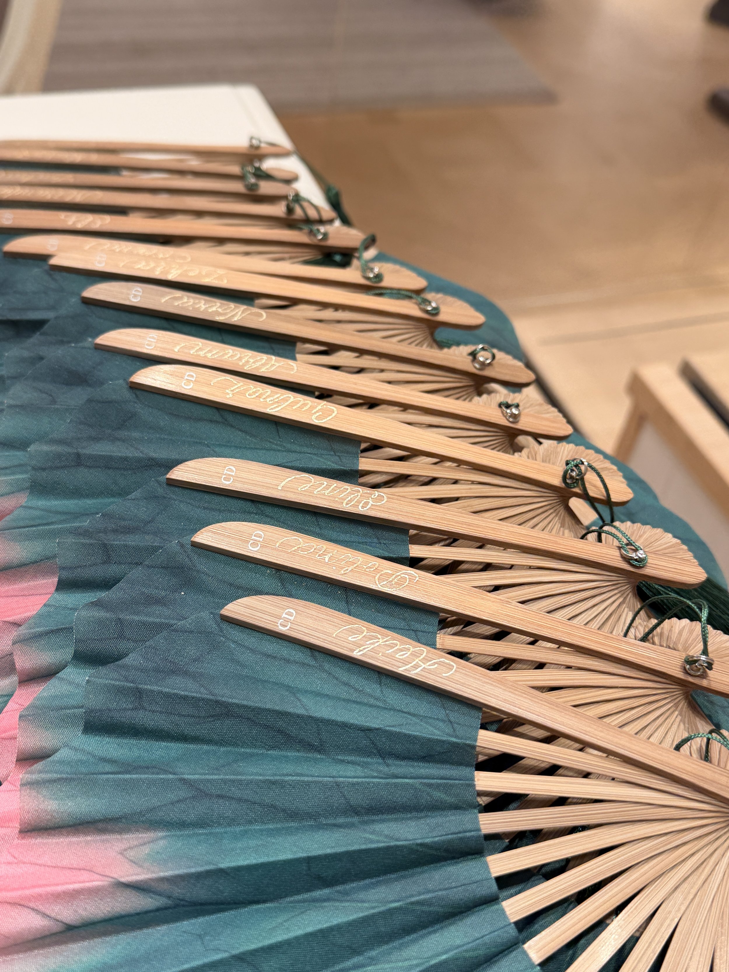 A collection of wooden hand fans with calligraphy engraving