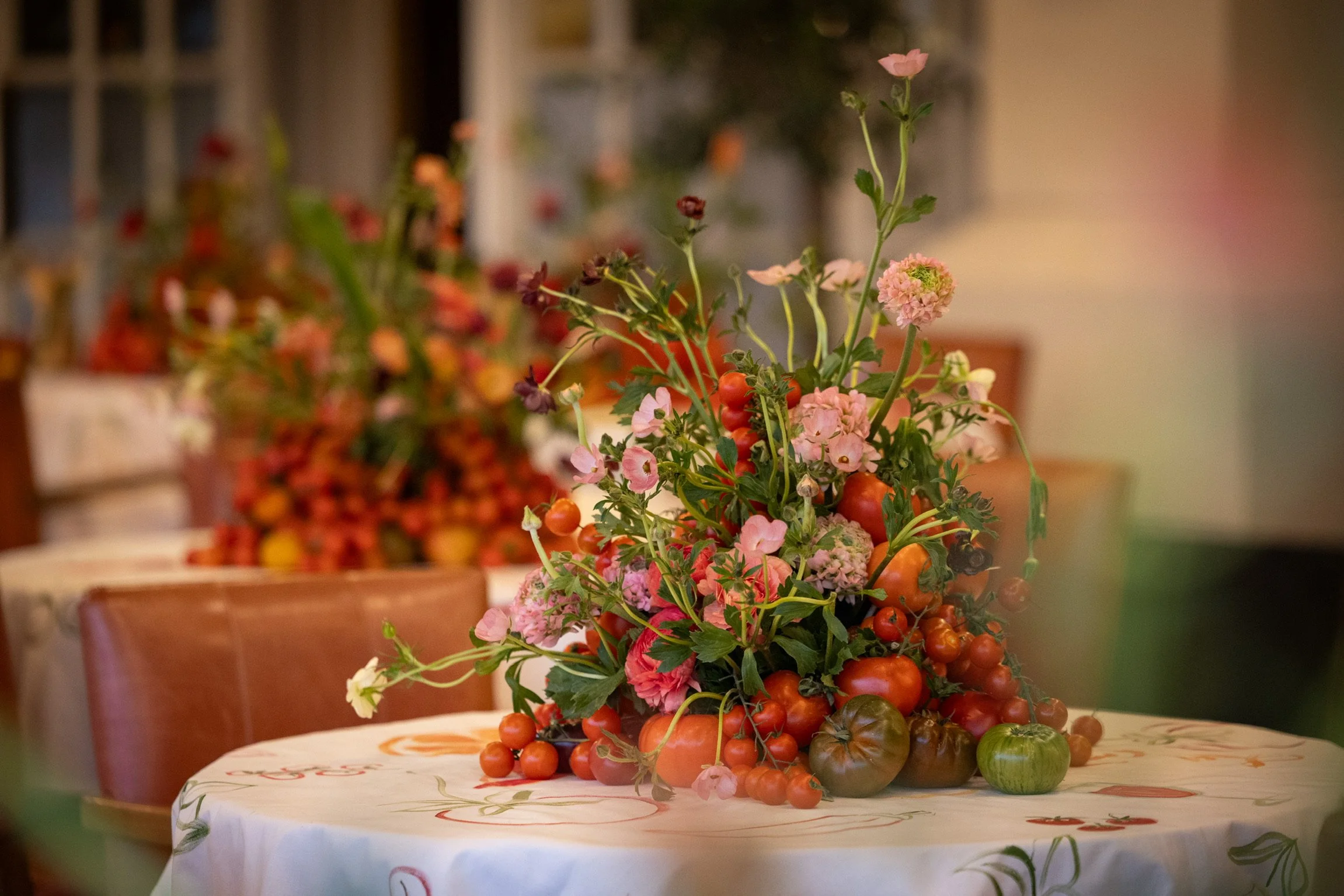 Brushwork and colourful details from a bespoke hand-painted tablecloth