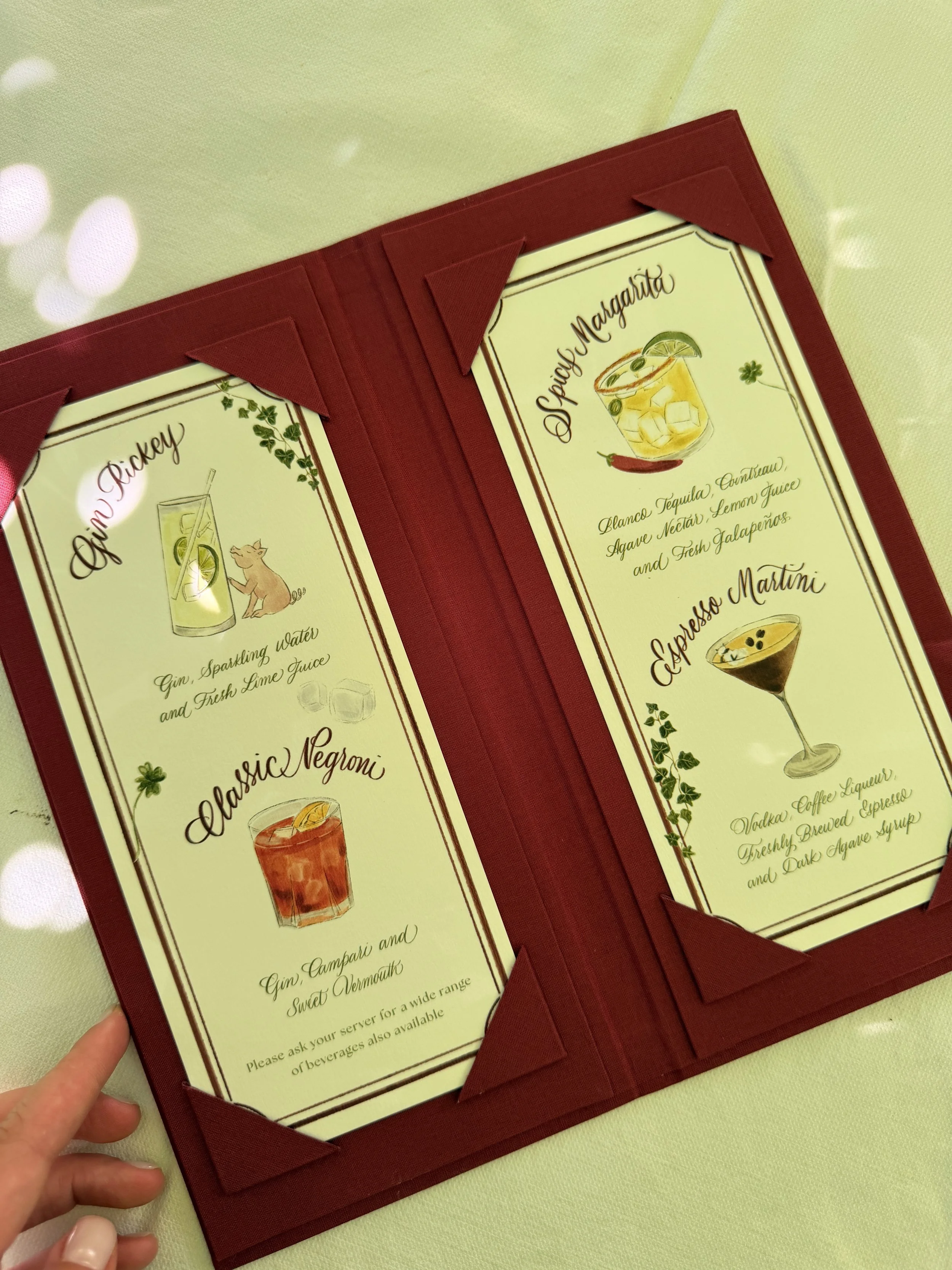 Close-up of the binding and paper details of a custom wedding booklet