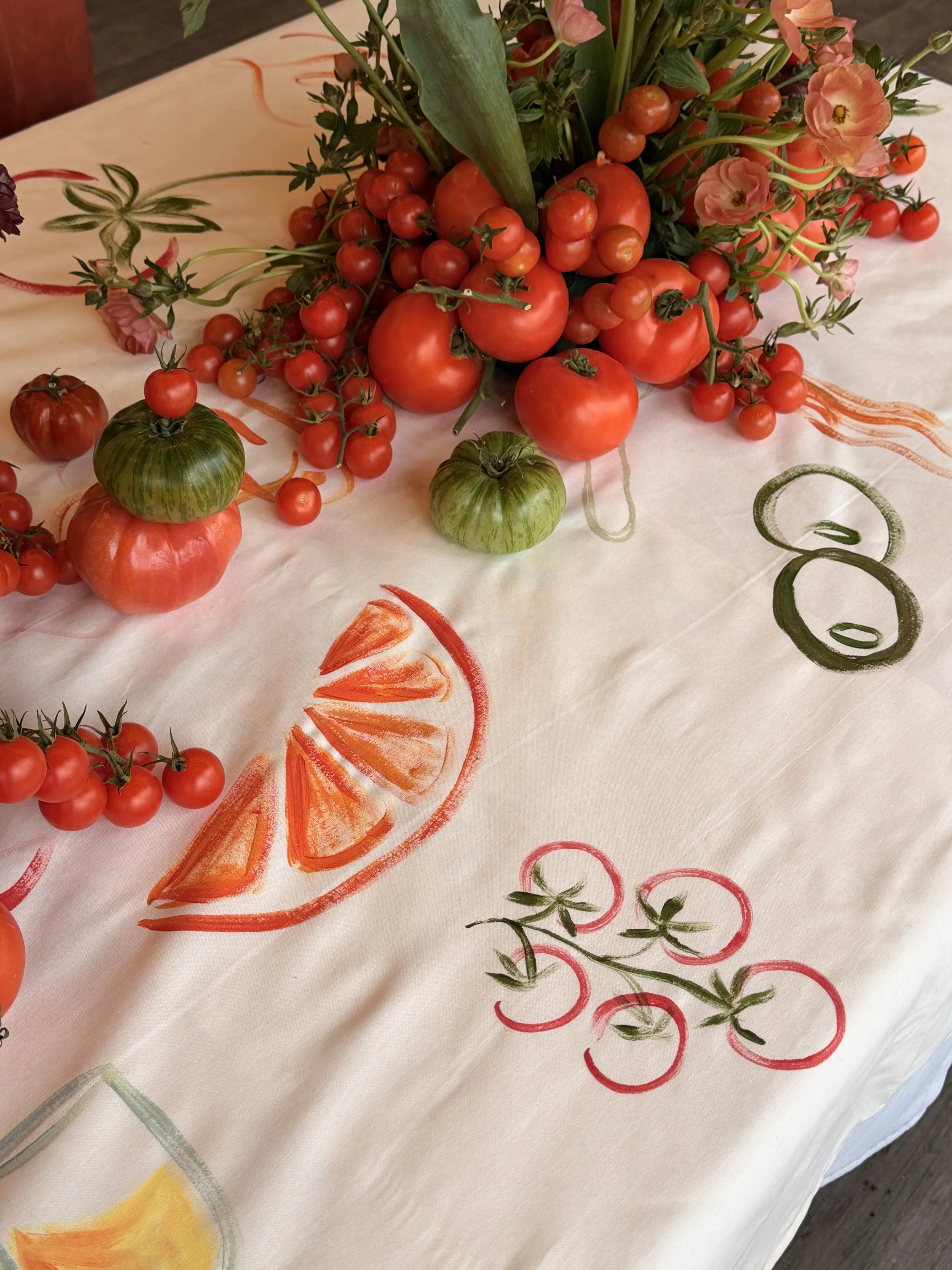 Gaia Amsterdam creating custom-painted tablecloths for a TikTok brand dinner