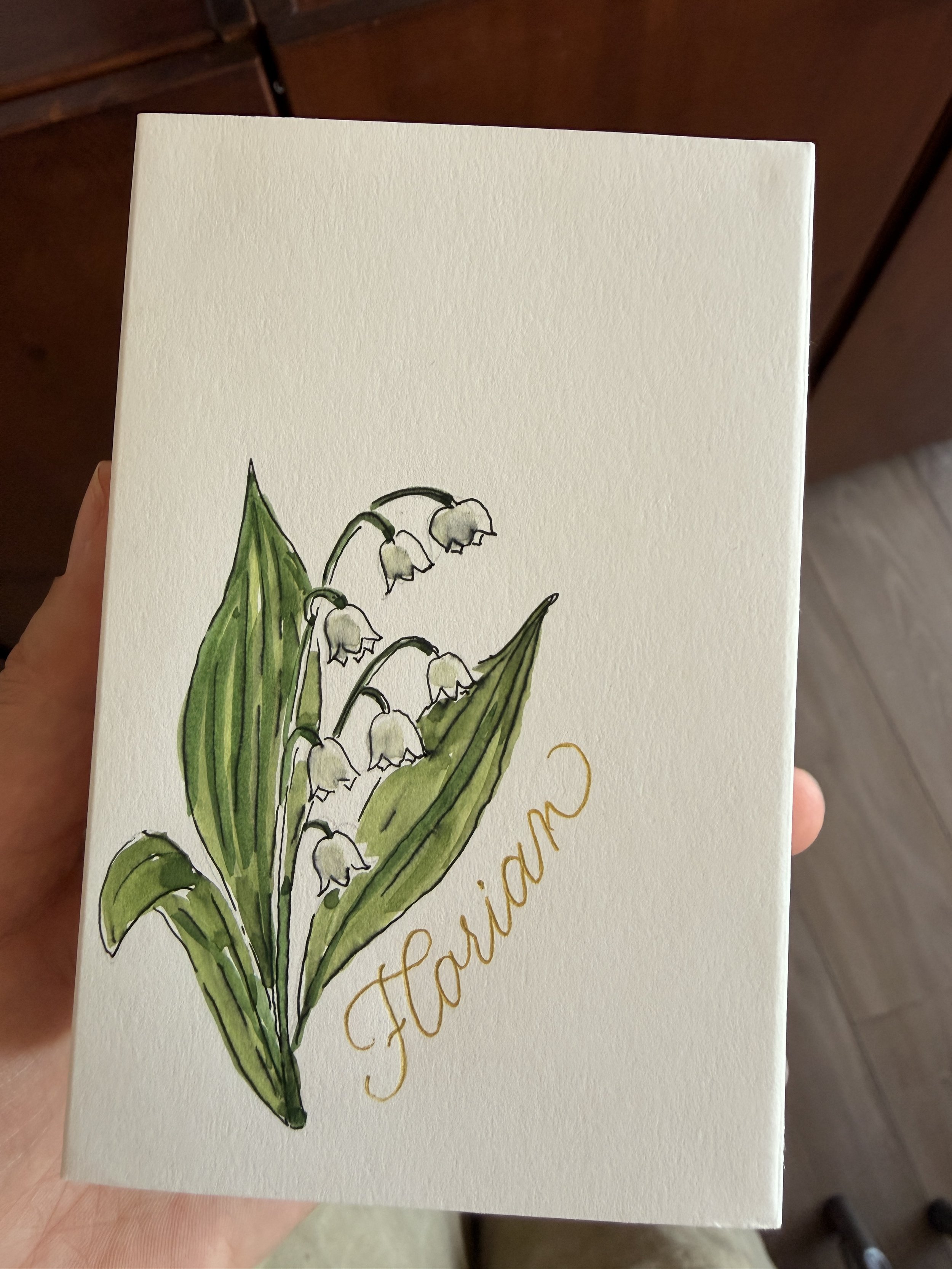 Dior inspired illustration of the Lily of the Valley in a box with calligraphy details.