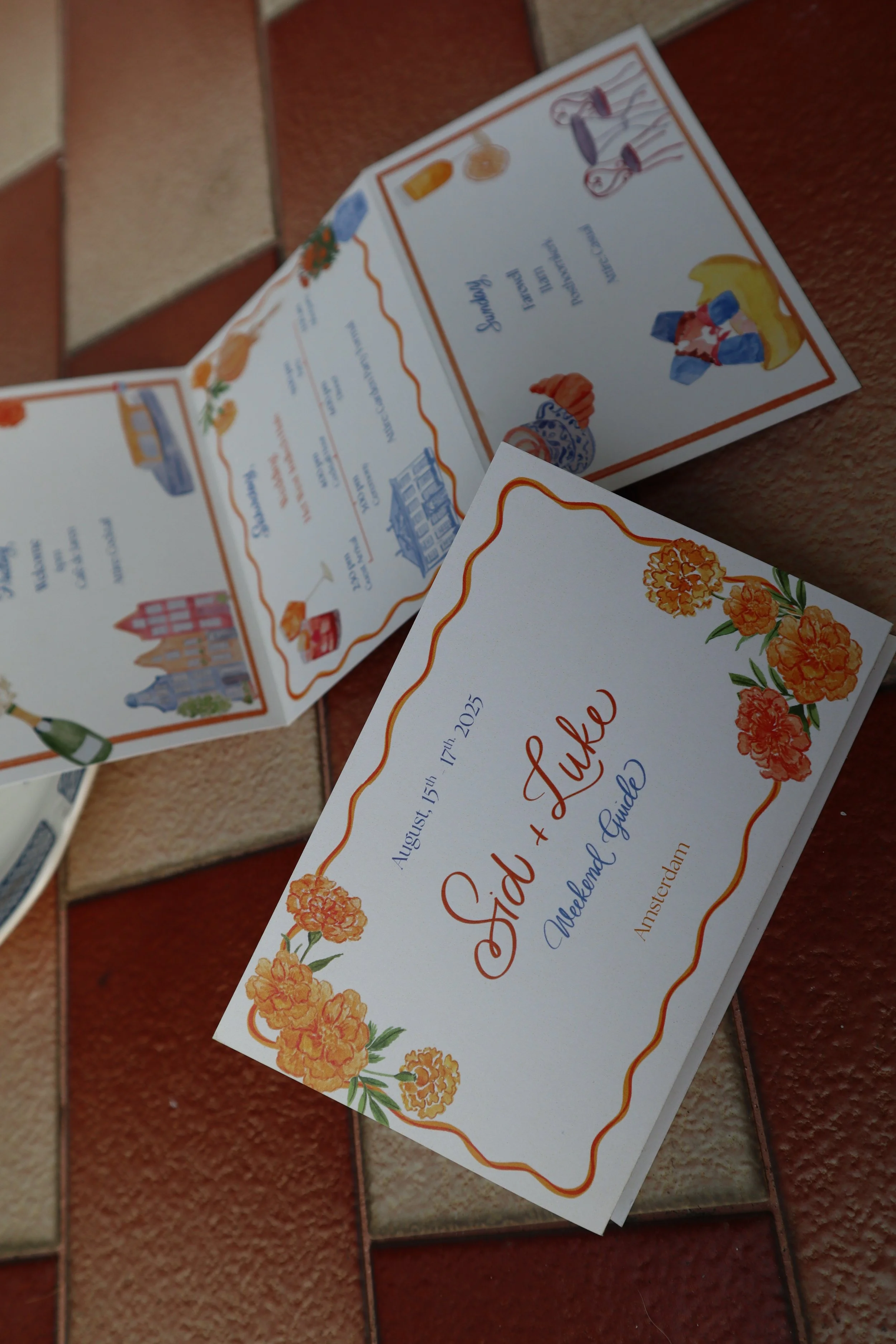 Open travel guide booklet with floral design and text. Fully bespoke calligraphy and Illustrations