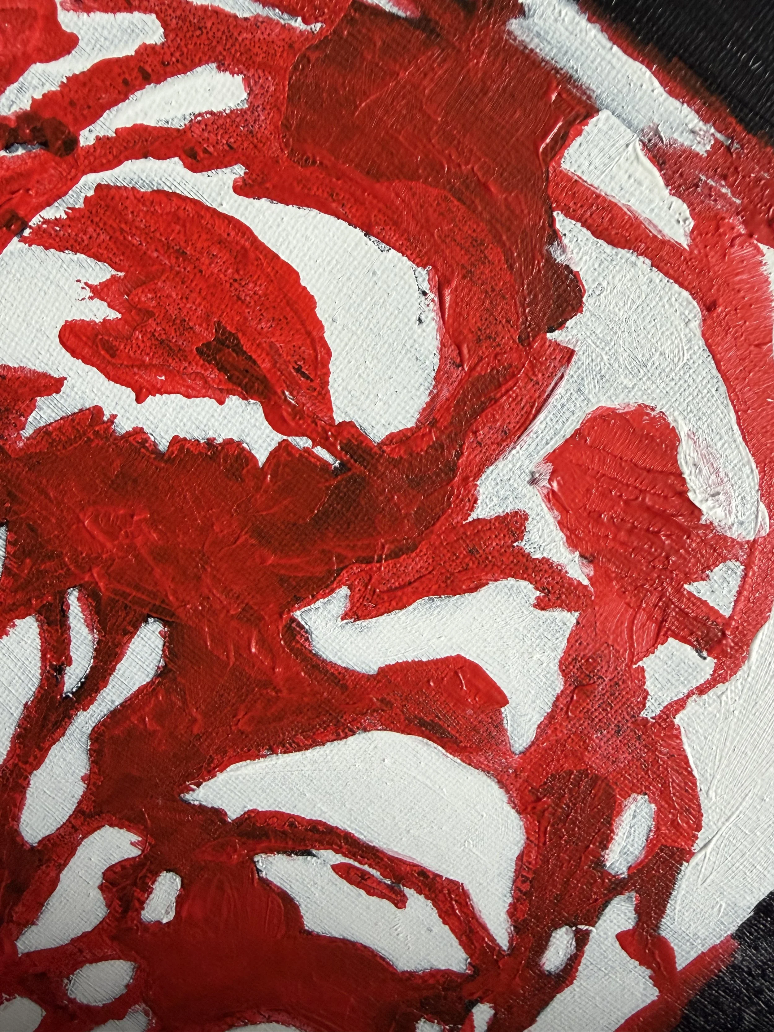 Close-up of an abstract painting with bold red, white, and black brushstrokes.